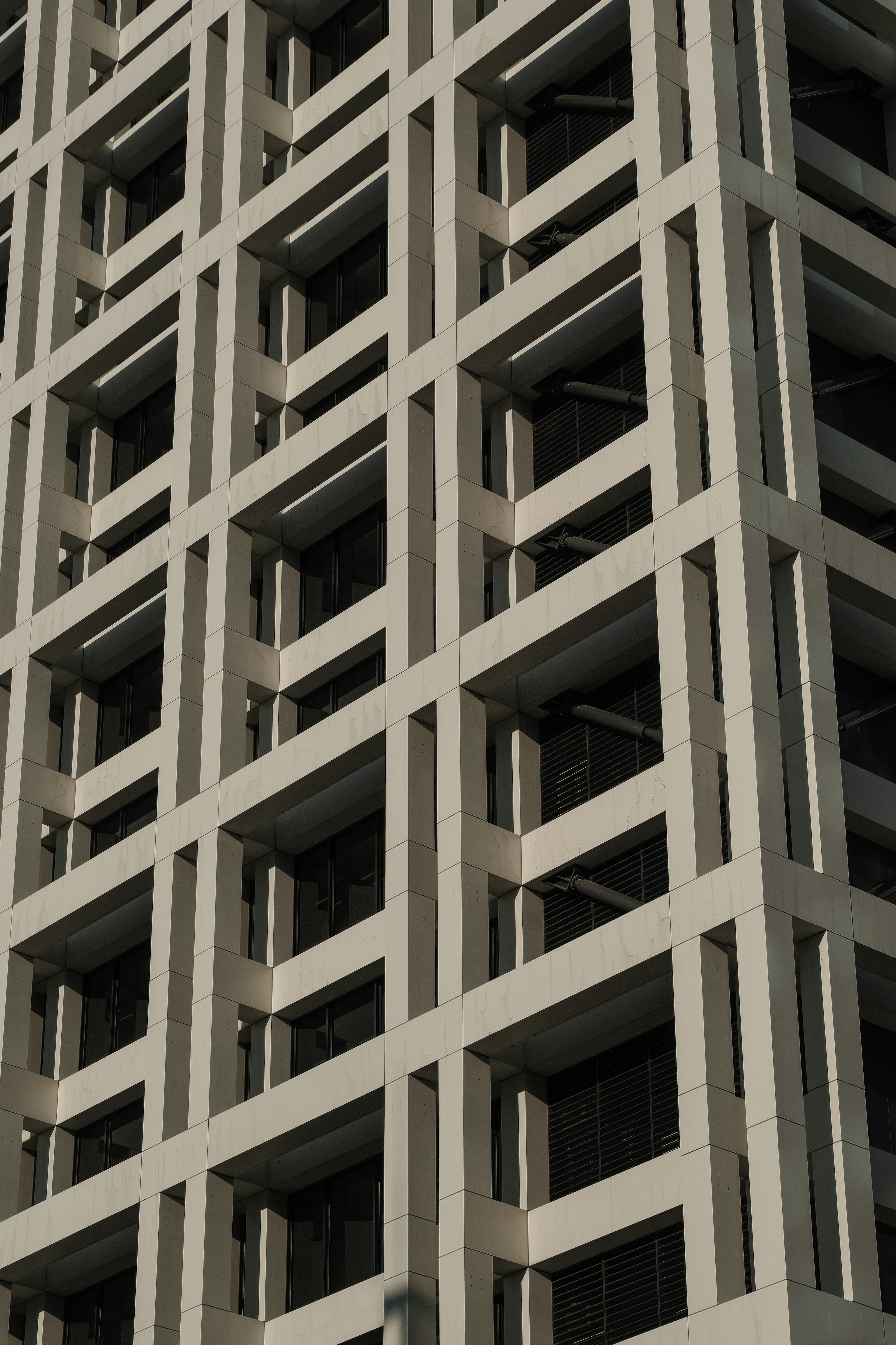 Facade of a concrete building with a grid pattern