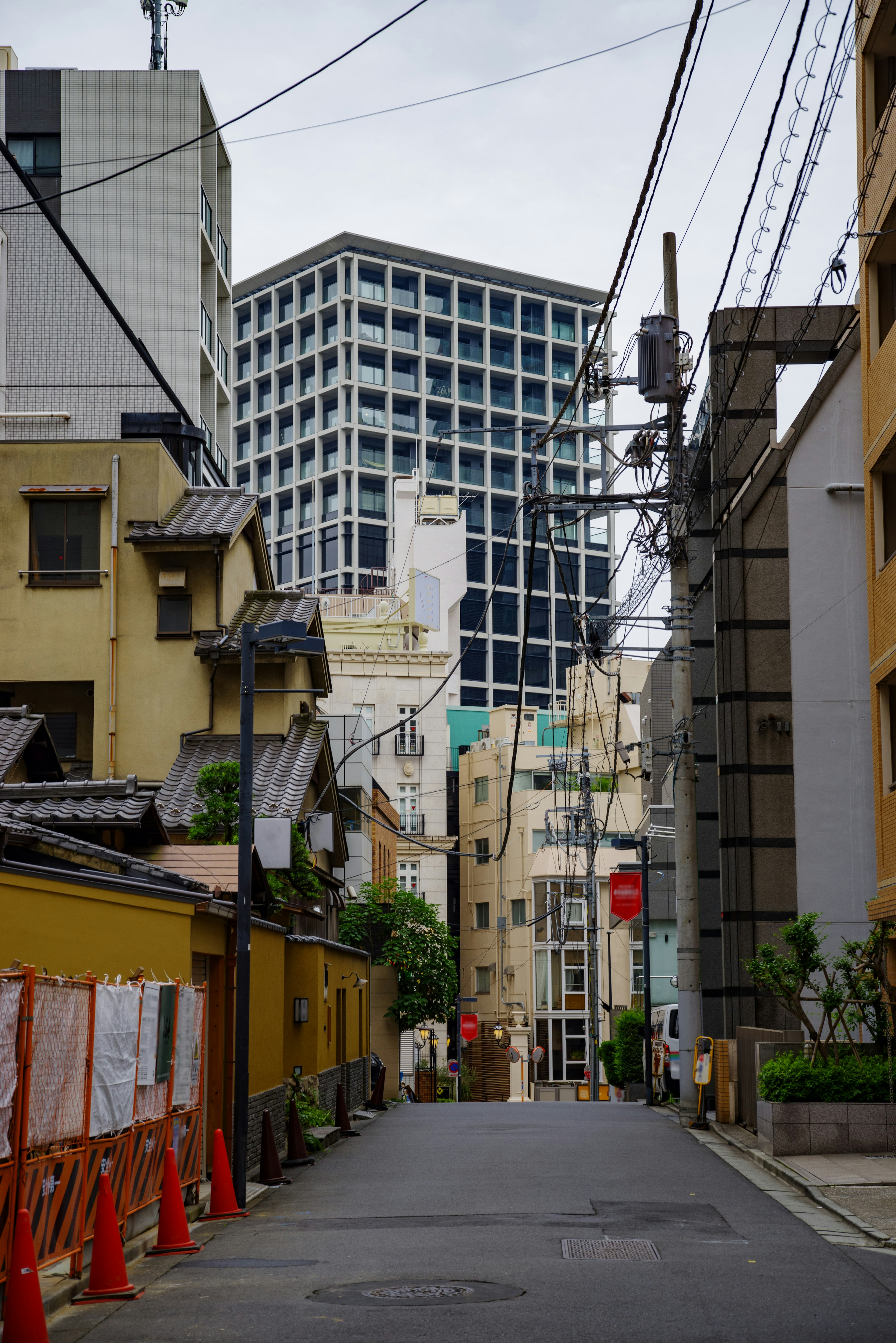 Narrow street showing urban architecture and high-rise buildings