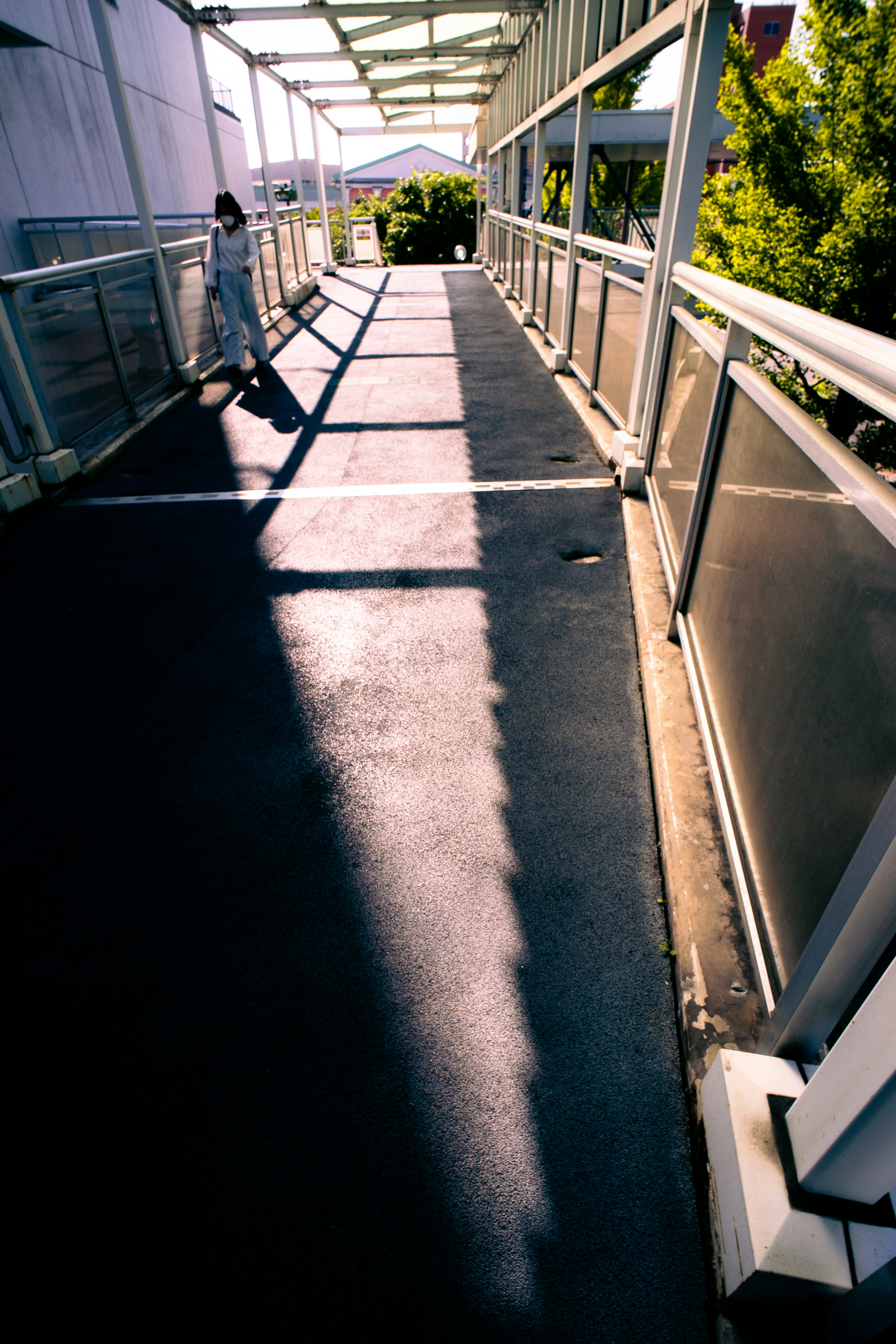 Bright walkway casting shadows