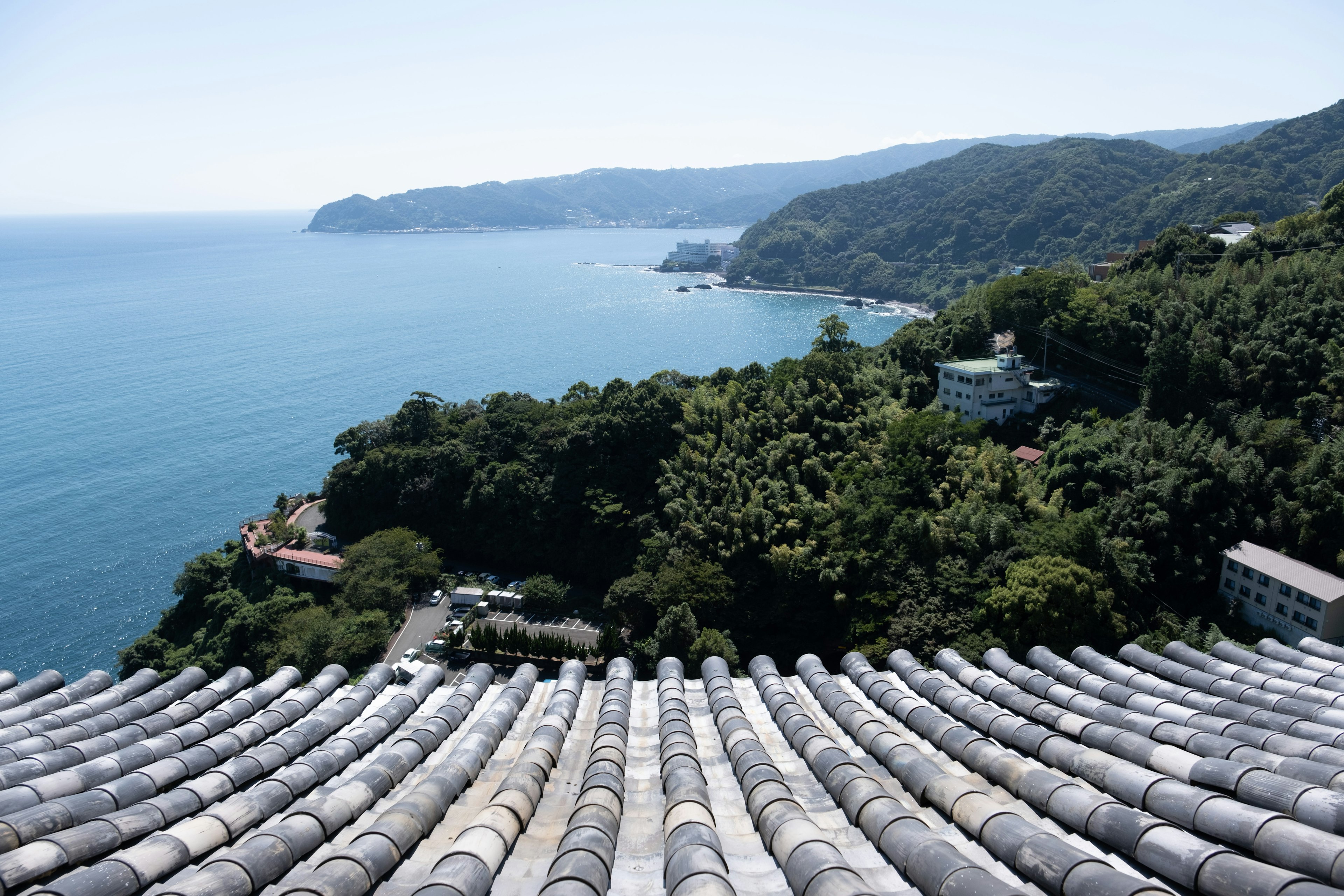 Beautiful landscape of sea and mountains view from a tiled roof