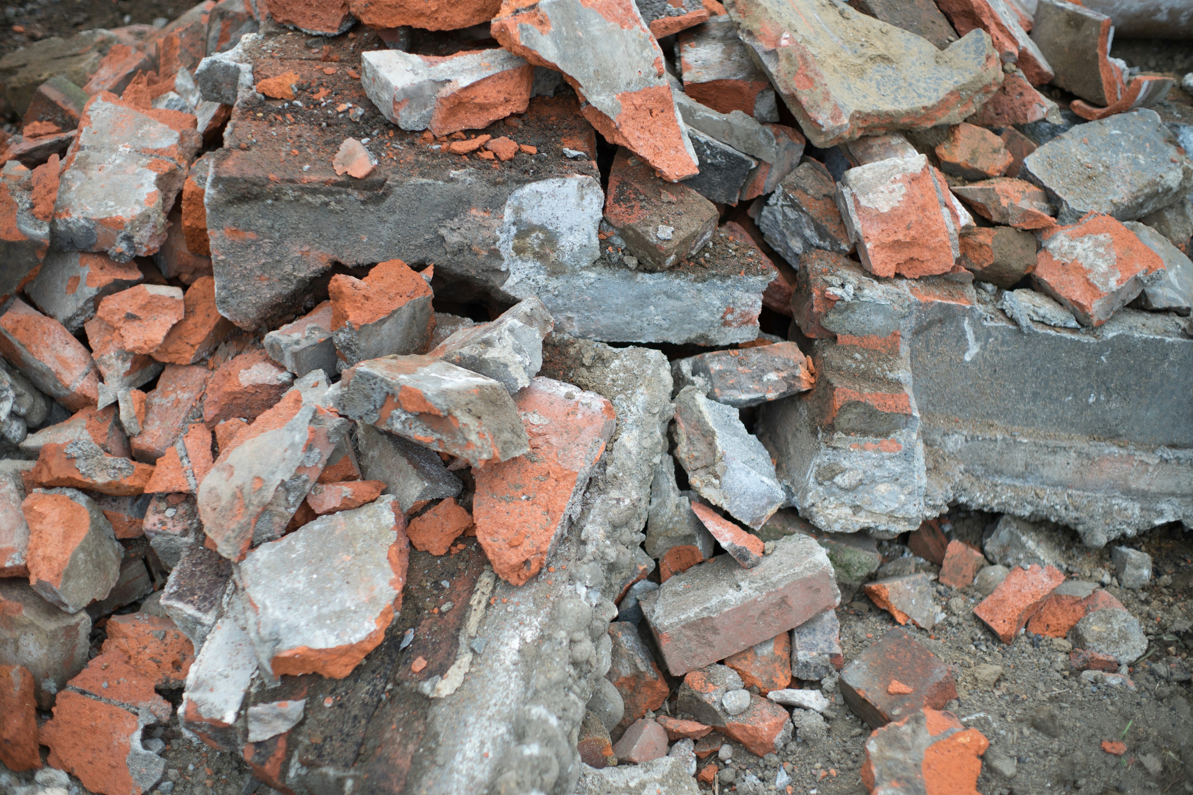 A pile of broken bricks and concrete fragments