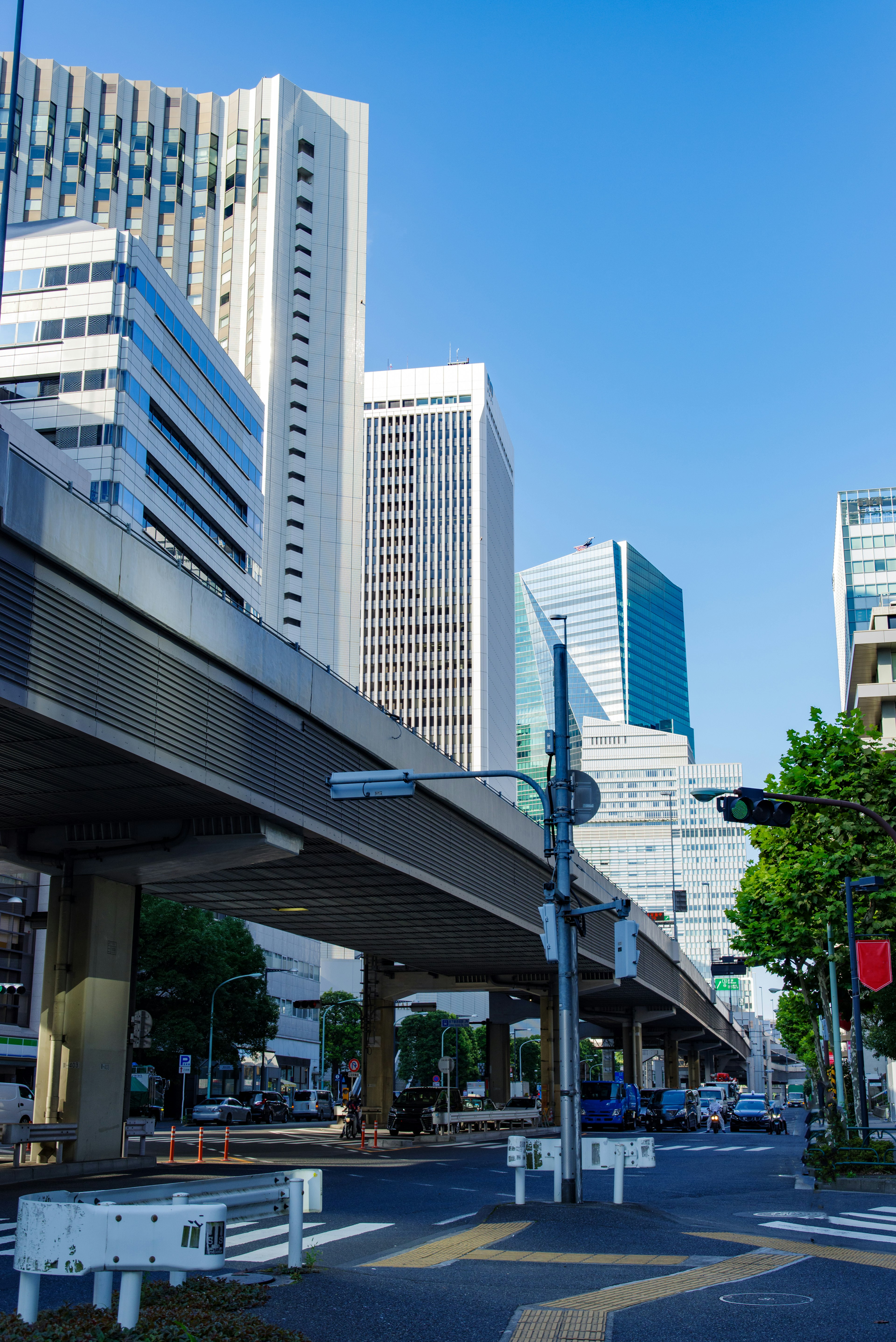 Urban skyline featuring high-rise buildings and a clear blue sky