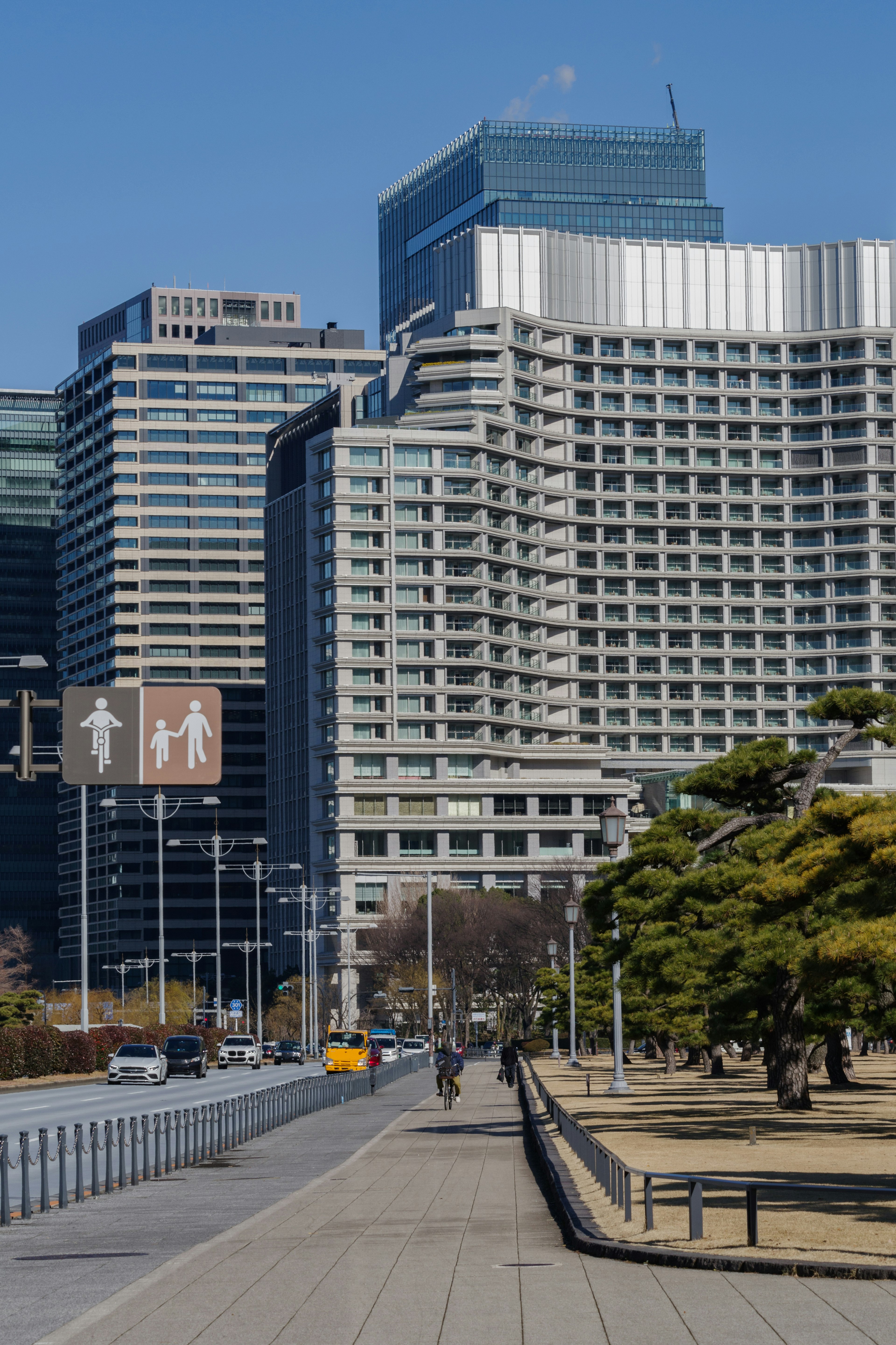 Modern buildings in Tokyo with pedestrian signs visible