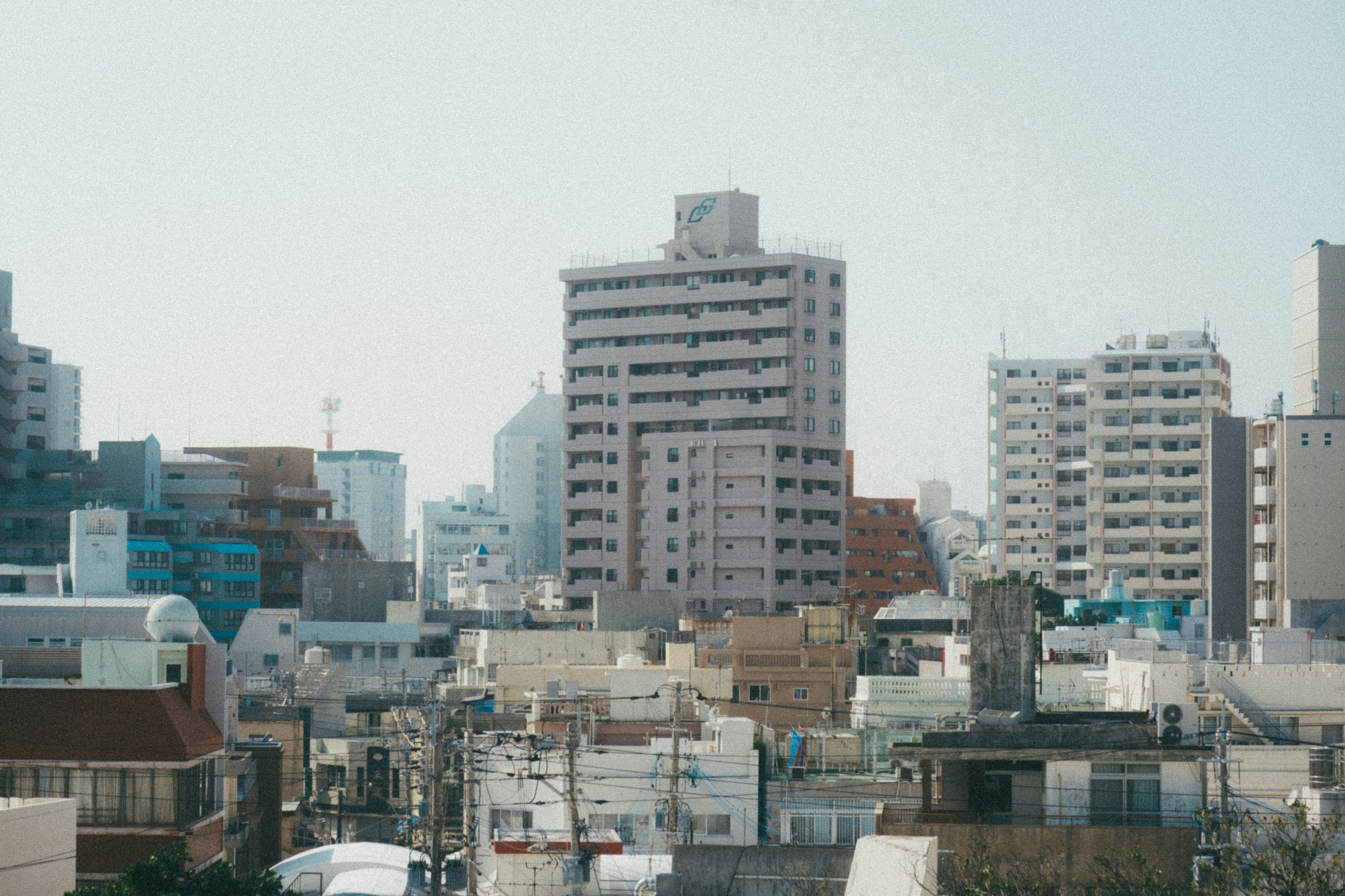 City skyline featuring tall buildings under a clear blue sky