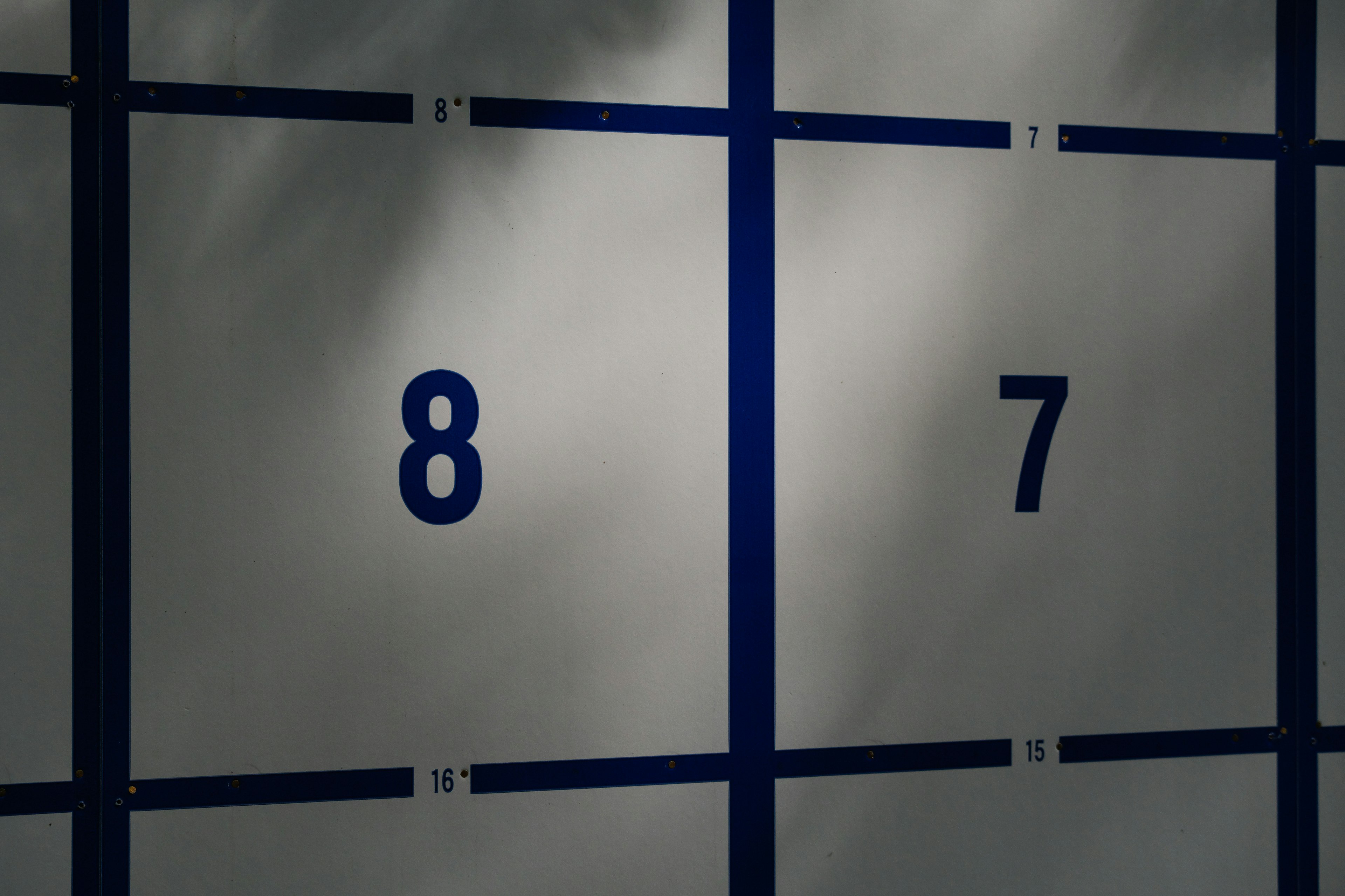 Transparent panel featuring blue numbers 8 and 7