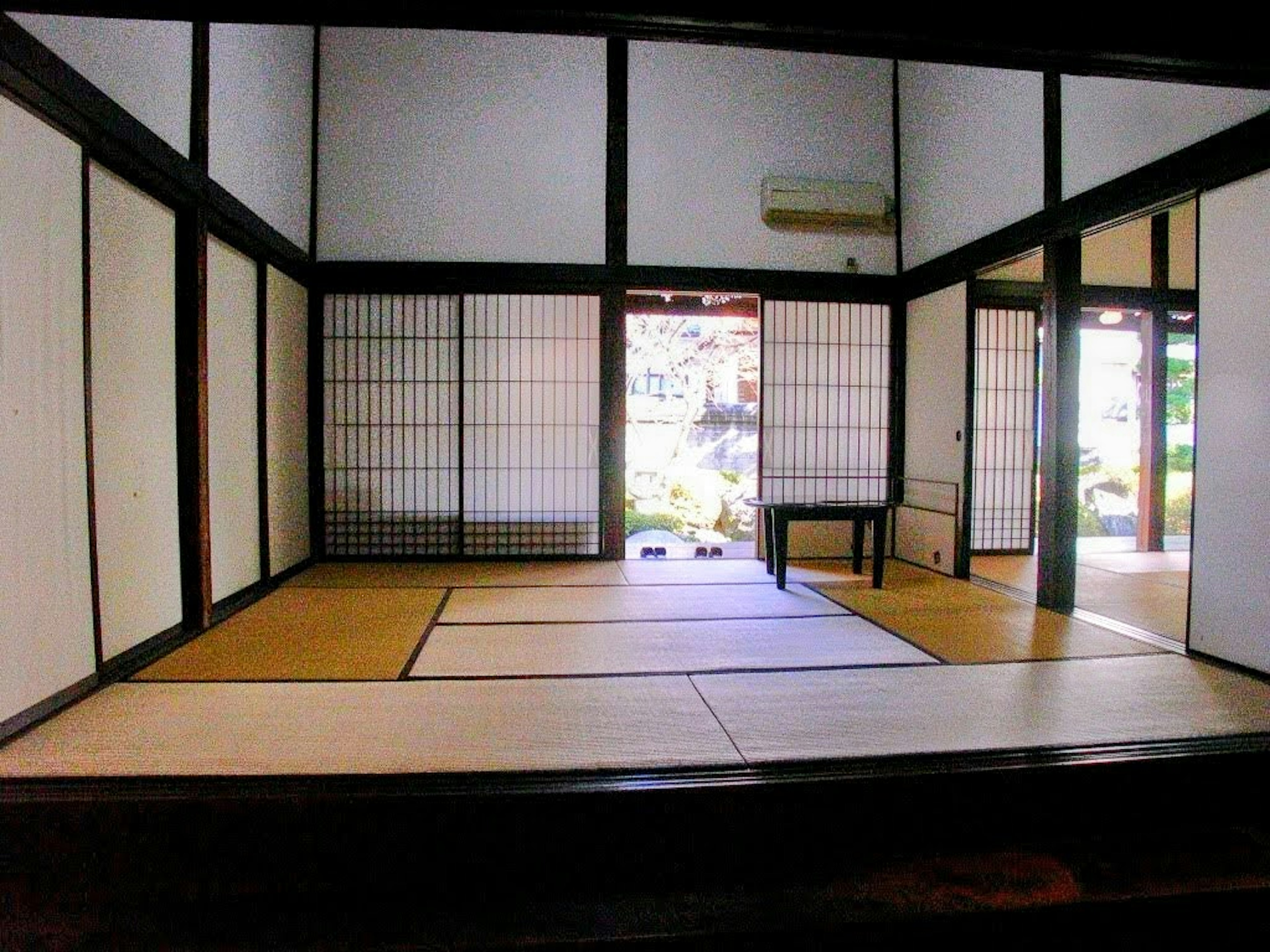 Interior of a traditional Japanese tatami room with shoji screens