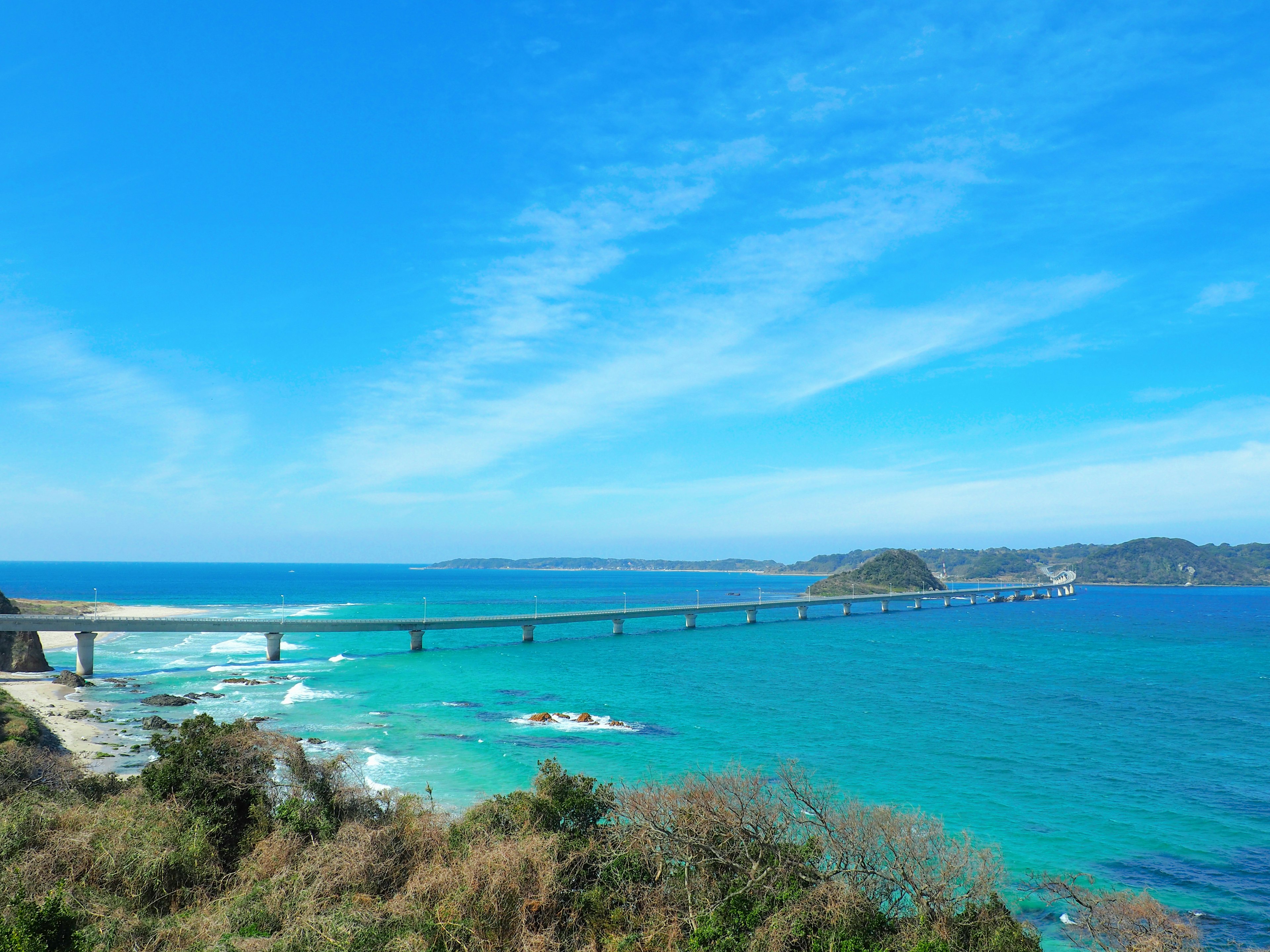 Beautiful landscape with blue sea and sky bridge crossing the water