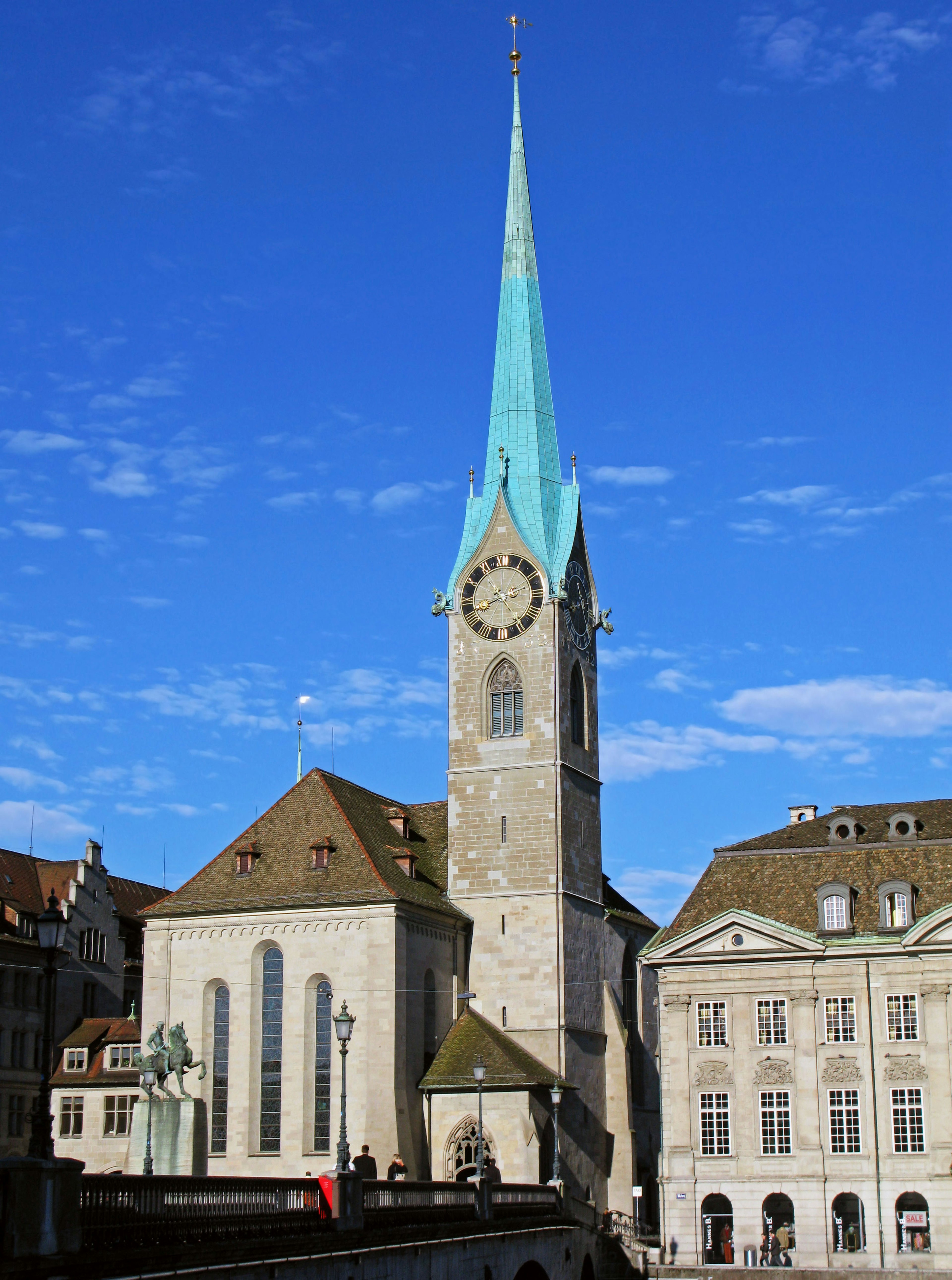 Image of a church in Zurich featuring a blue spire