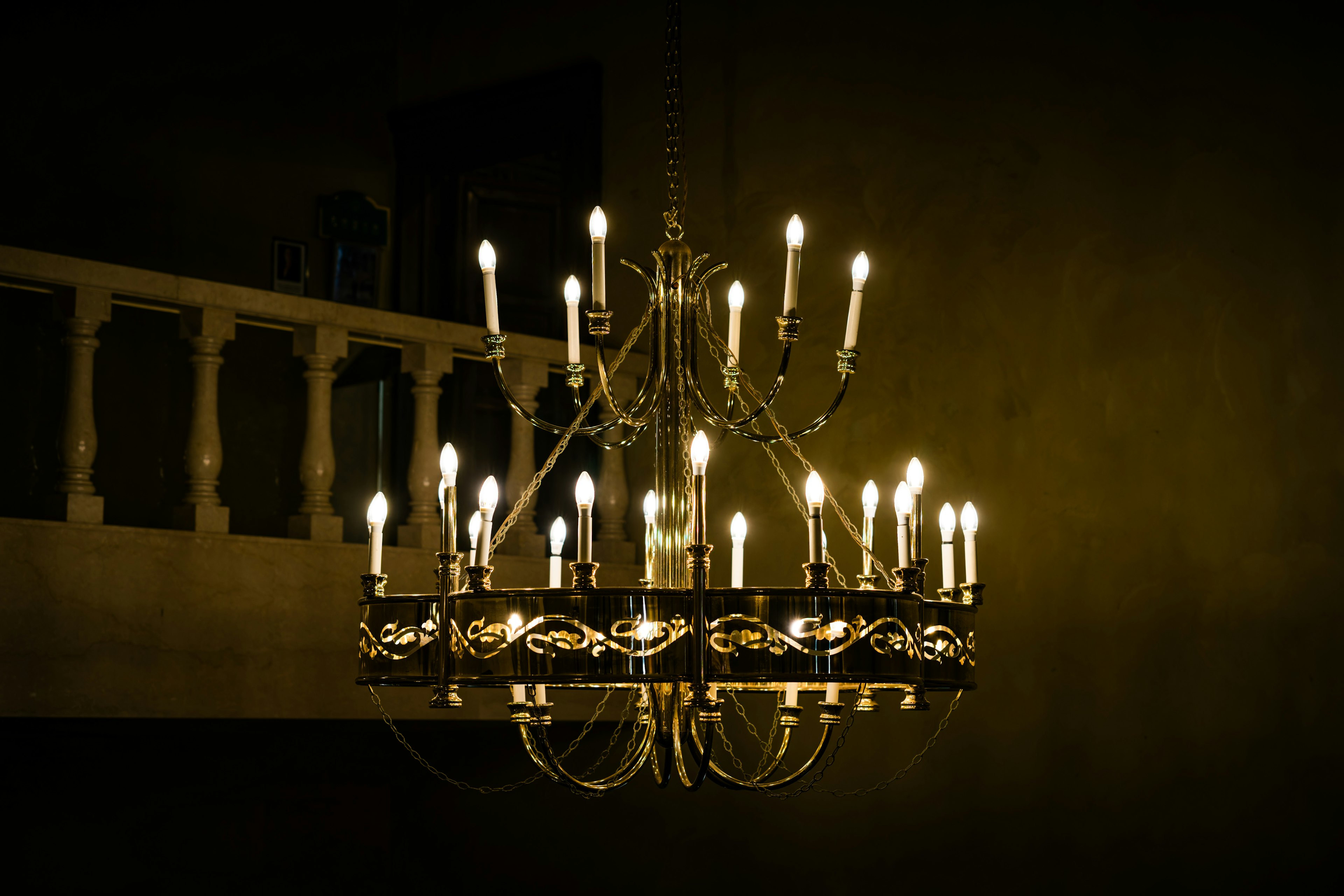 Chandelier illuminated against a dark background