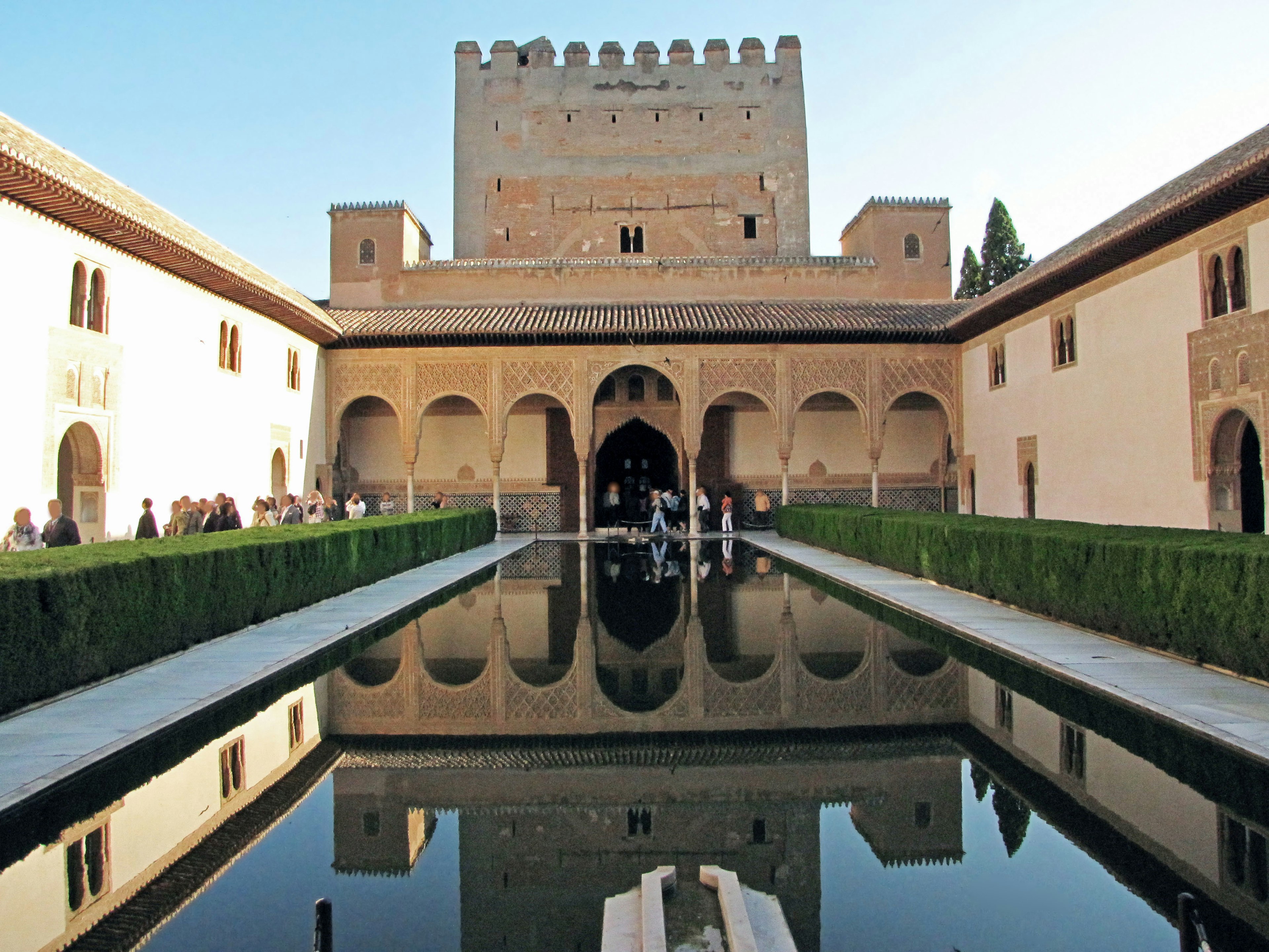 Stunning view of the Alhambra Palace courtyard reflecting in a serene pool