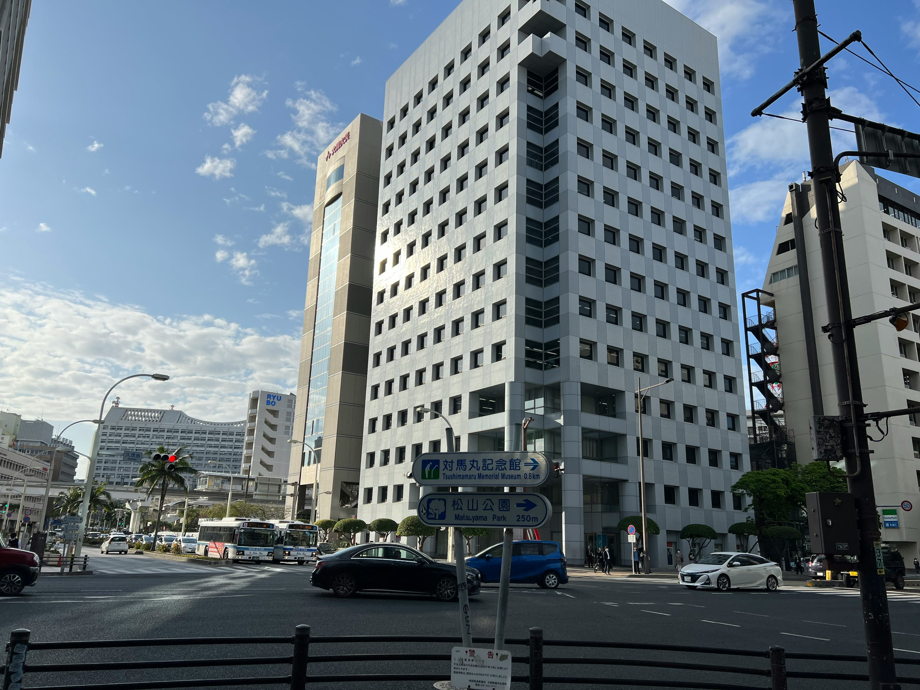 Street view featuring modern buildings and blue sky