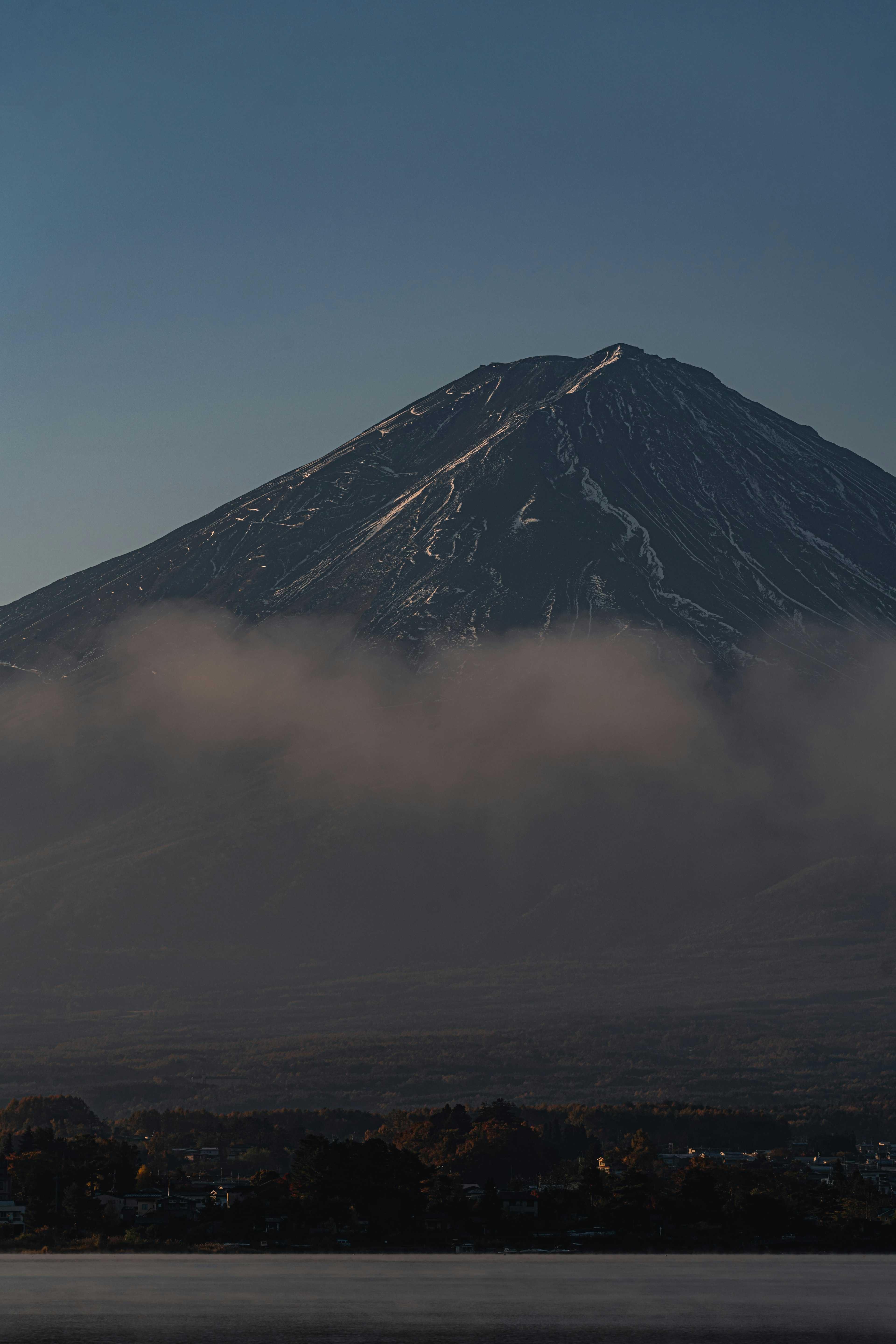 Snow-capped mountain with misty landscape