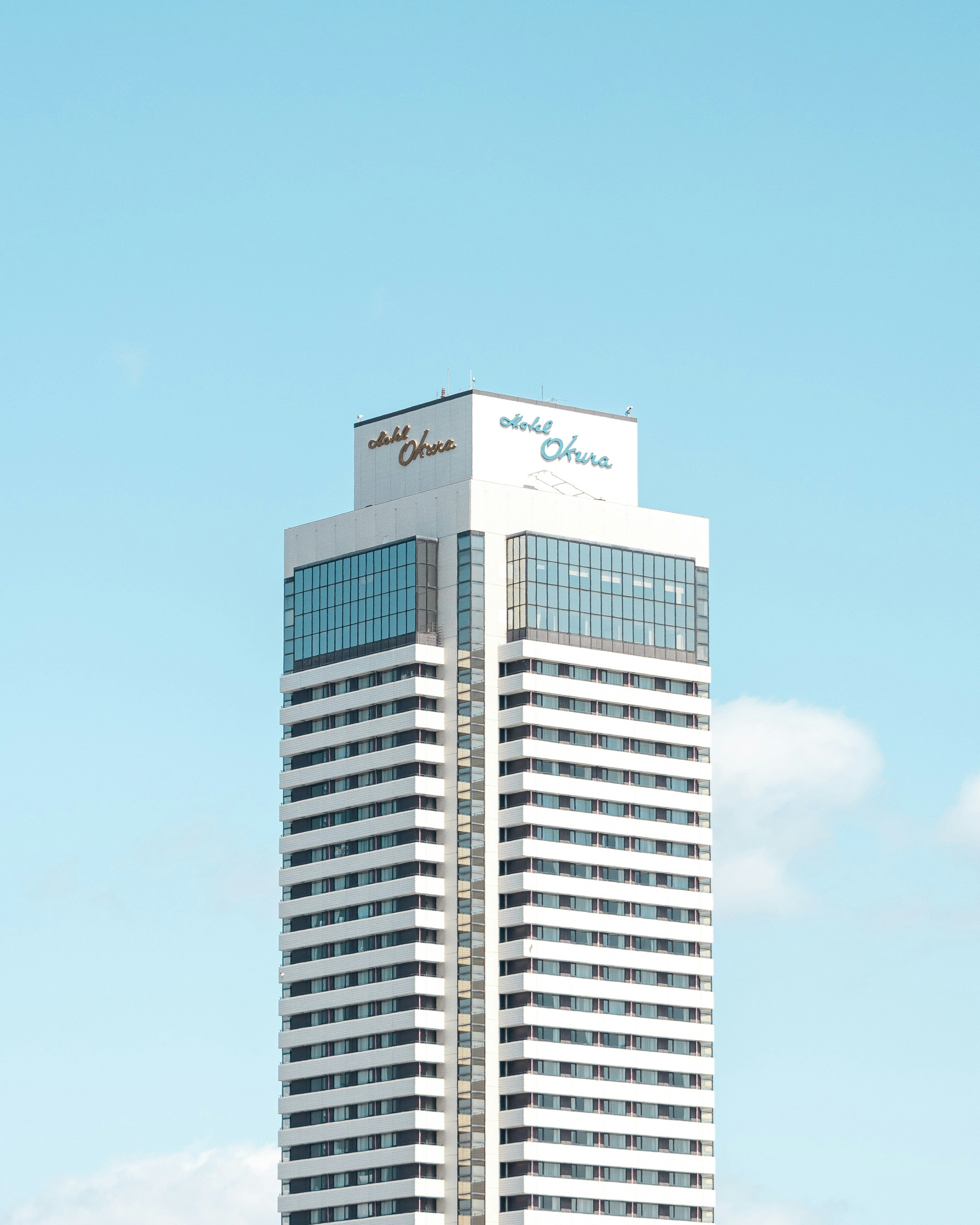 Tall building with a clear blue sky background