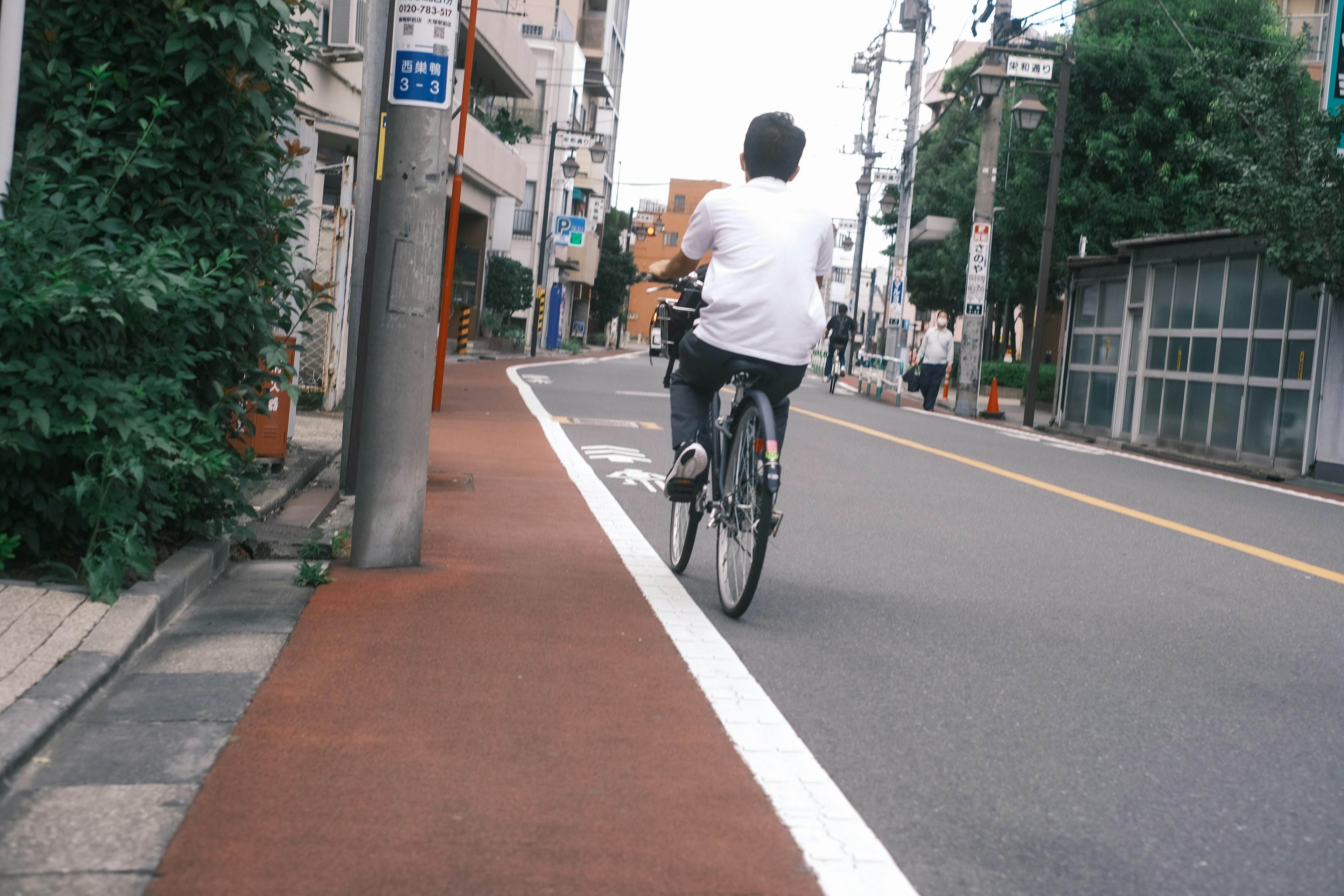 A man riding a bicycle on a city street