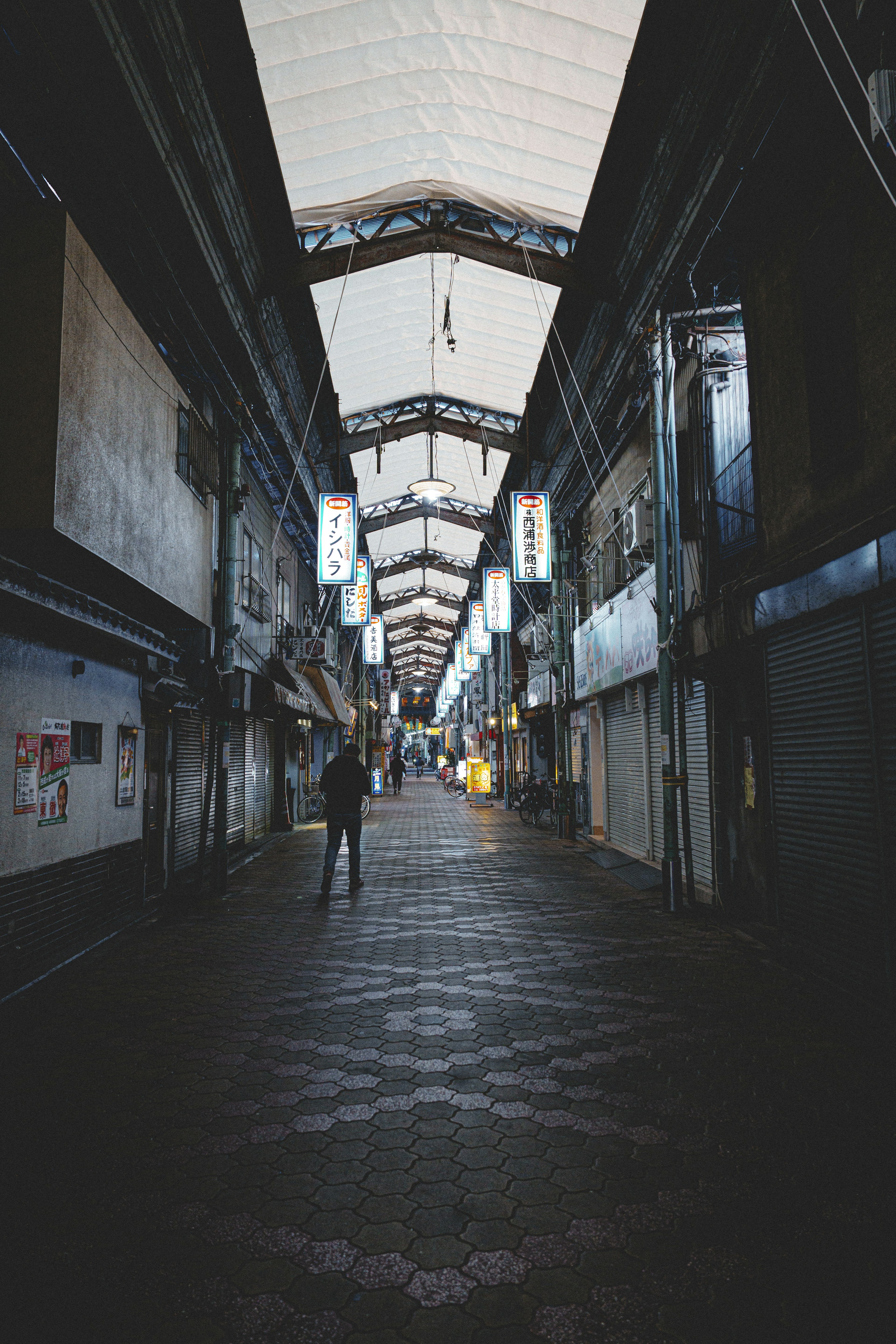 Empty shopping street with a long corridor and overhead canopy