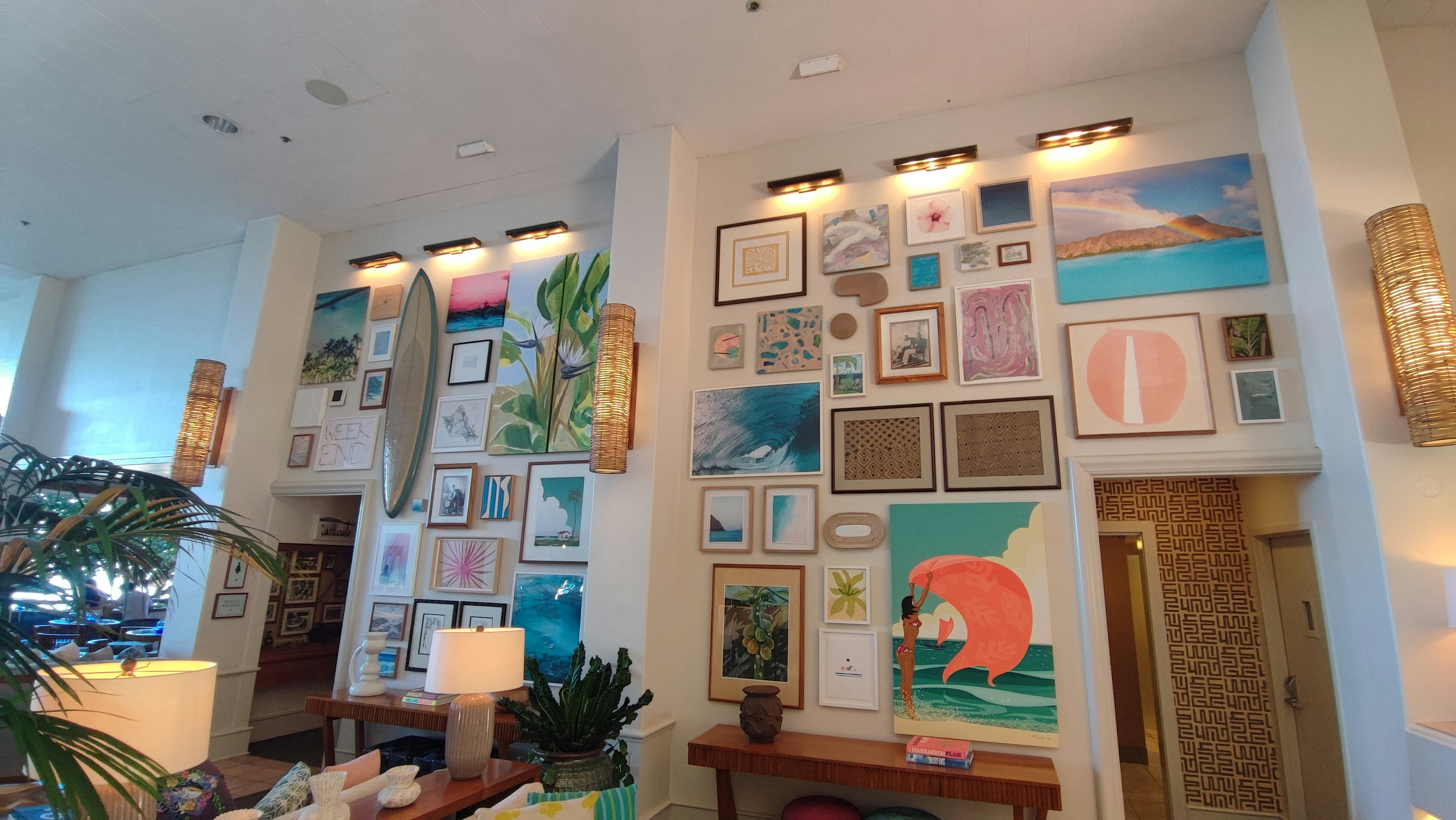 Modern lobby interior with bright colored art pieces displayed on the walls