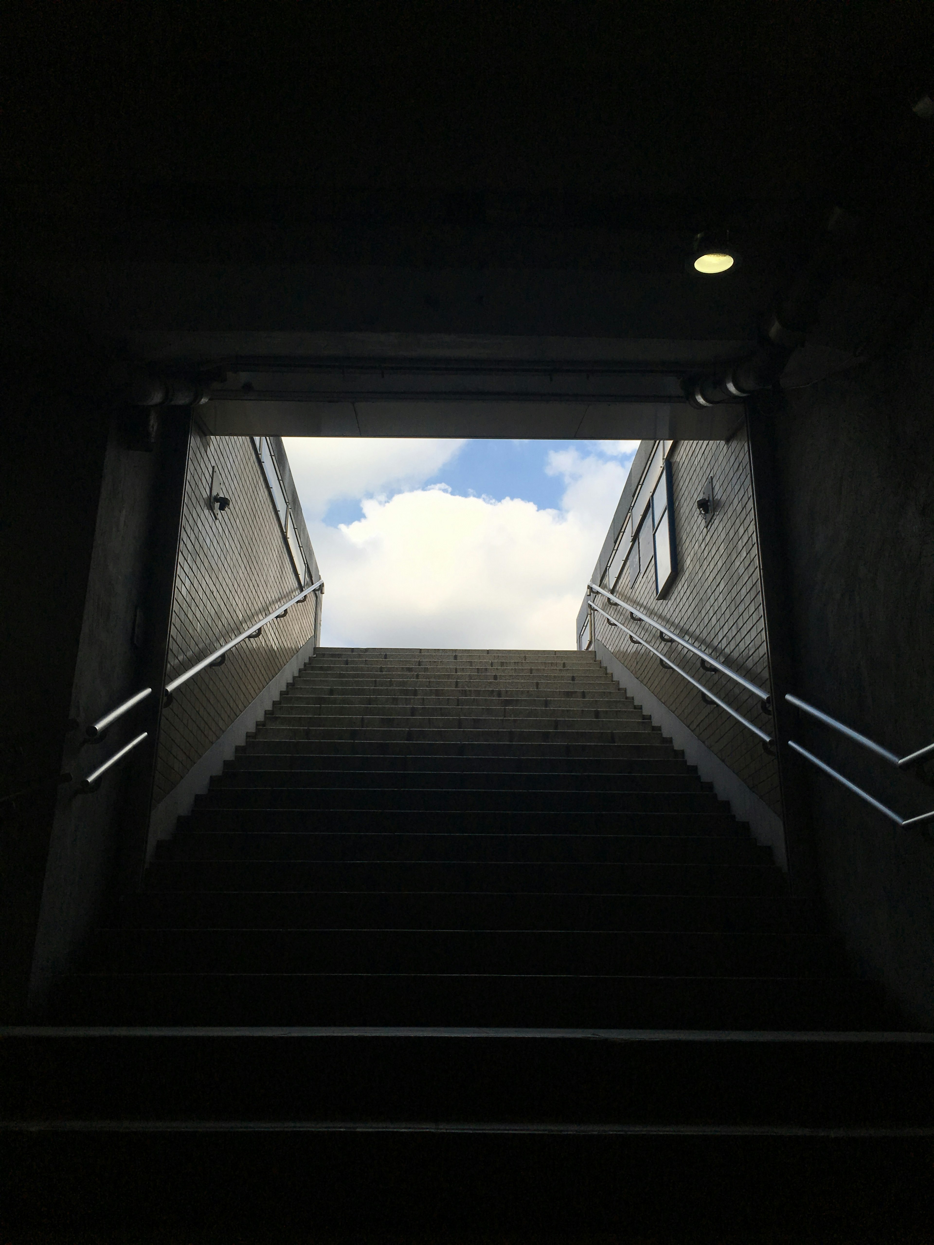 Staircase leading up to a bright sky