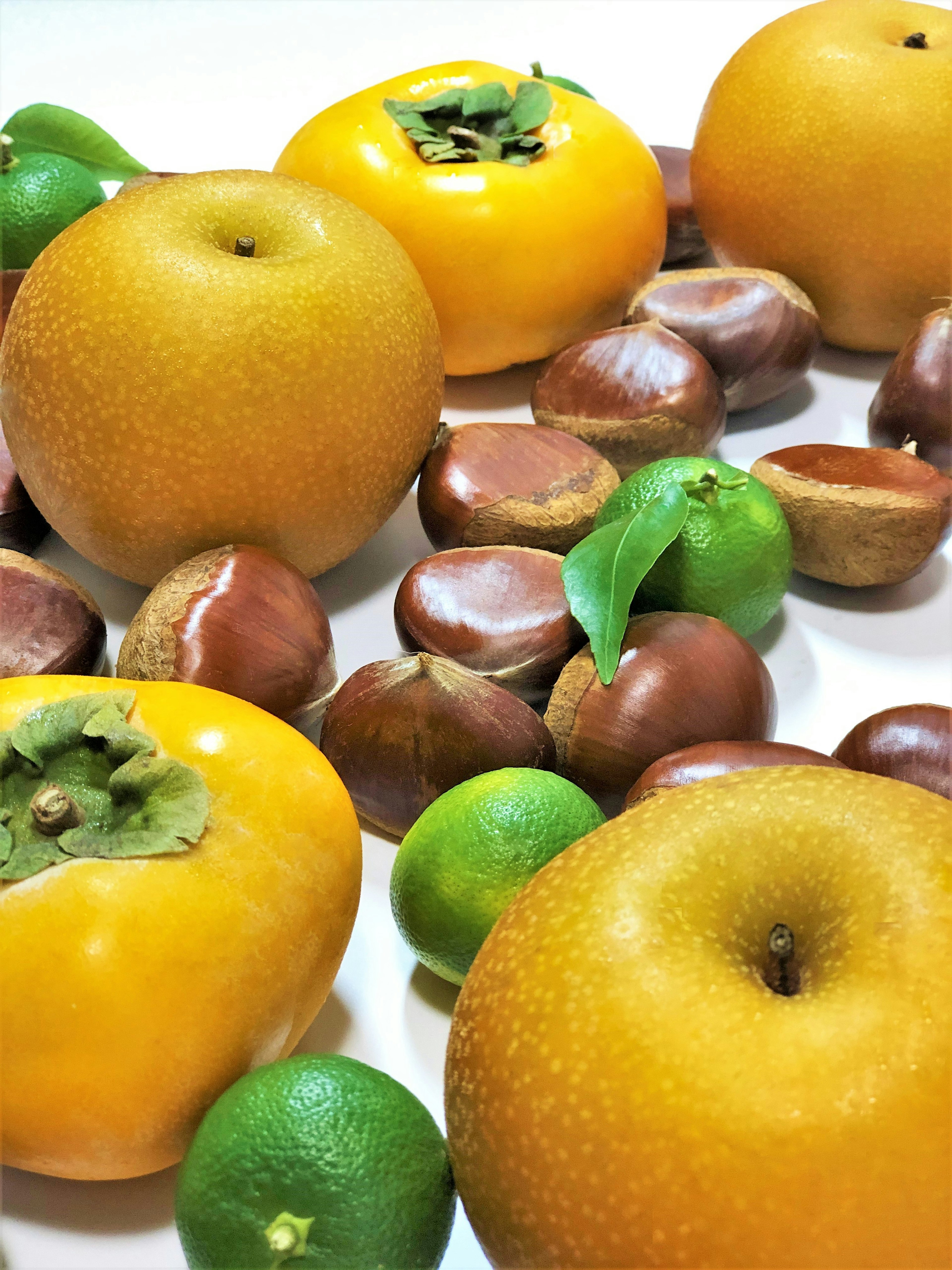 A vibrant arrangement of yellow fruits and green fruits