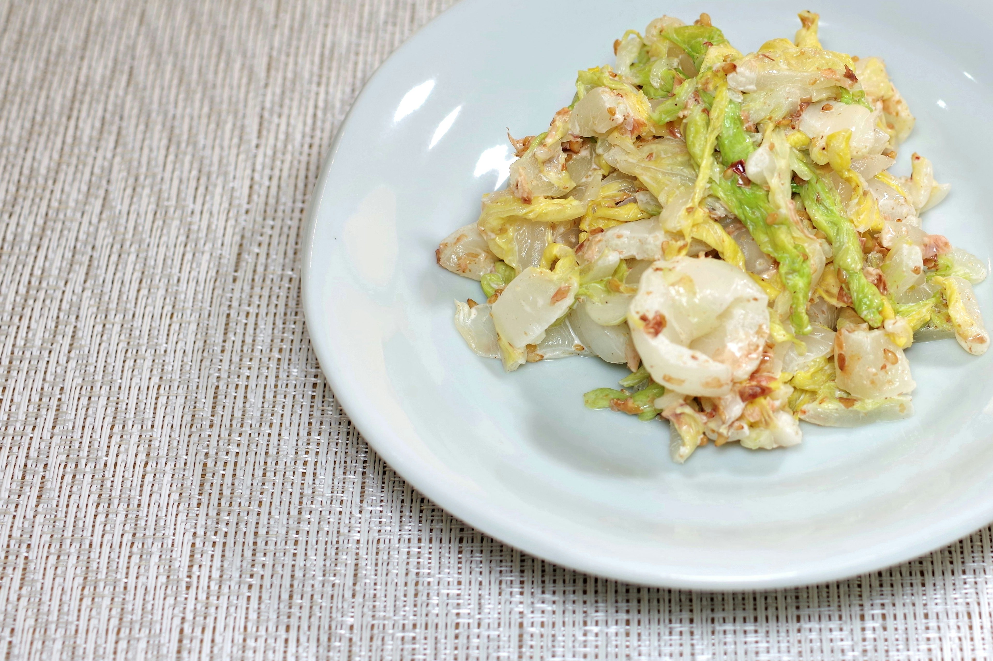 Stir-fried cabbage served on a white plate