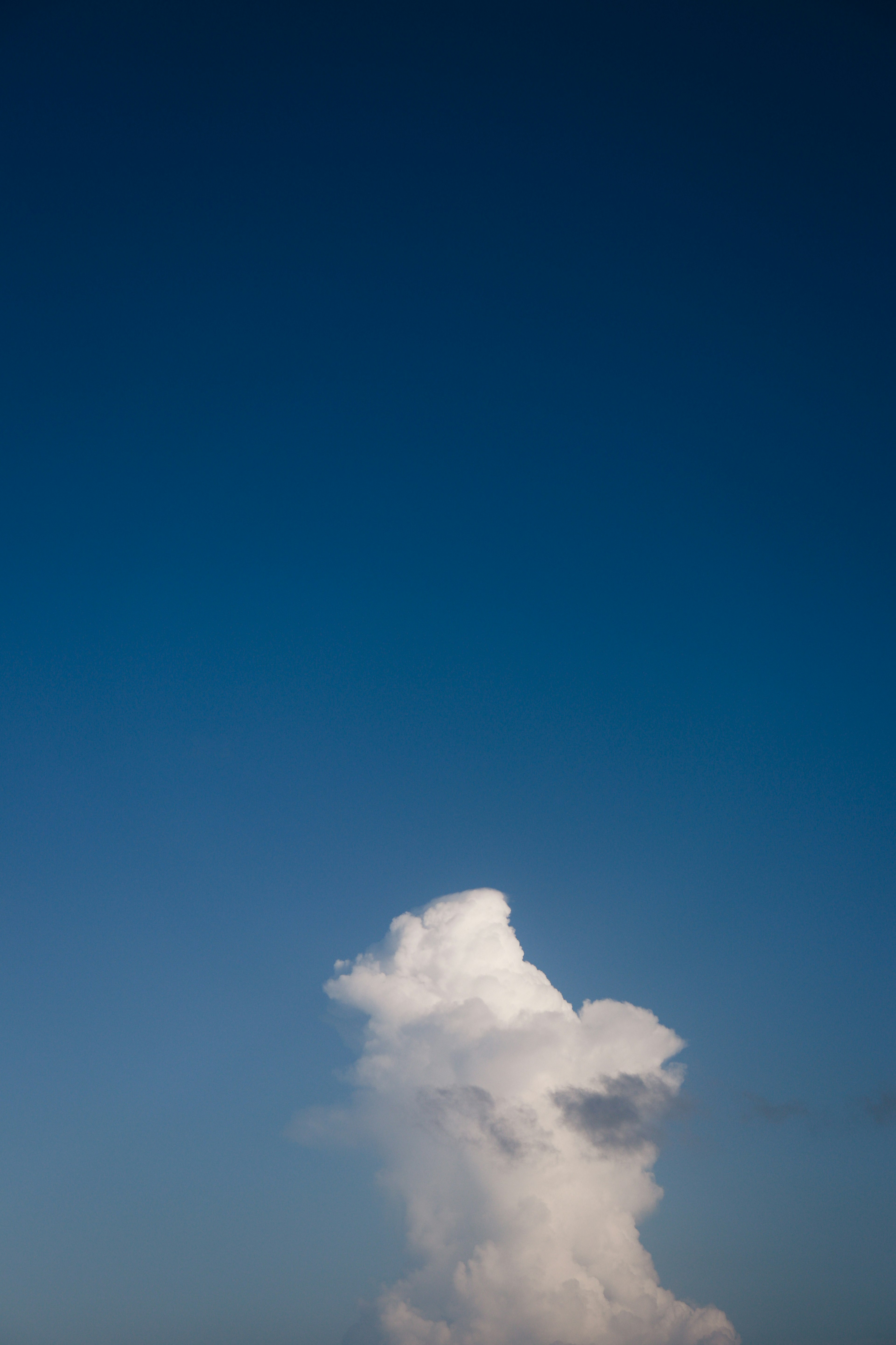 White cloud formation against a clear blue sky