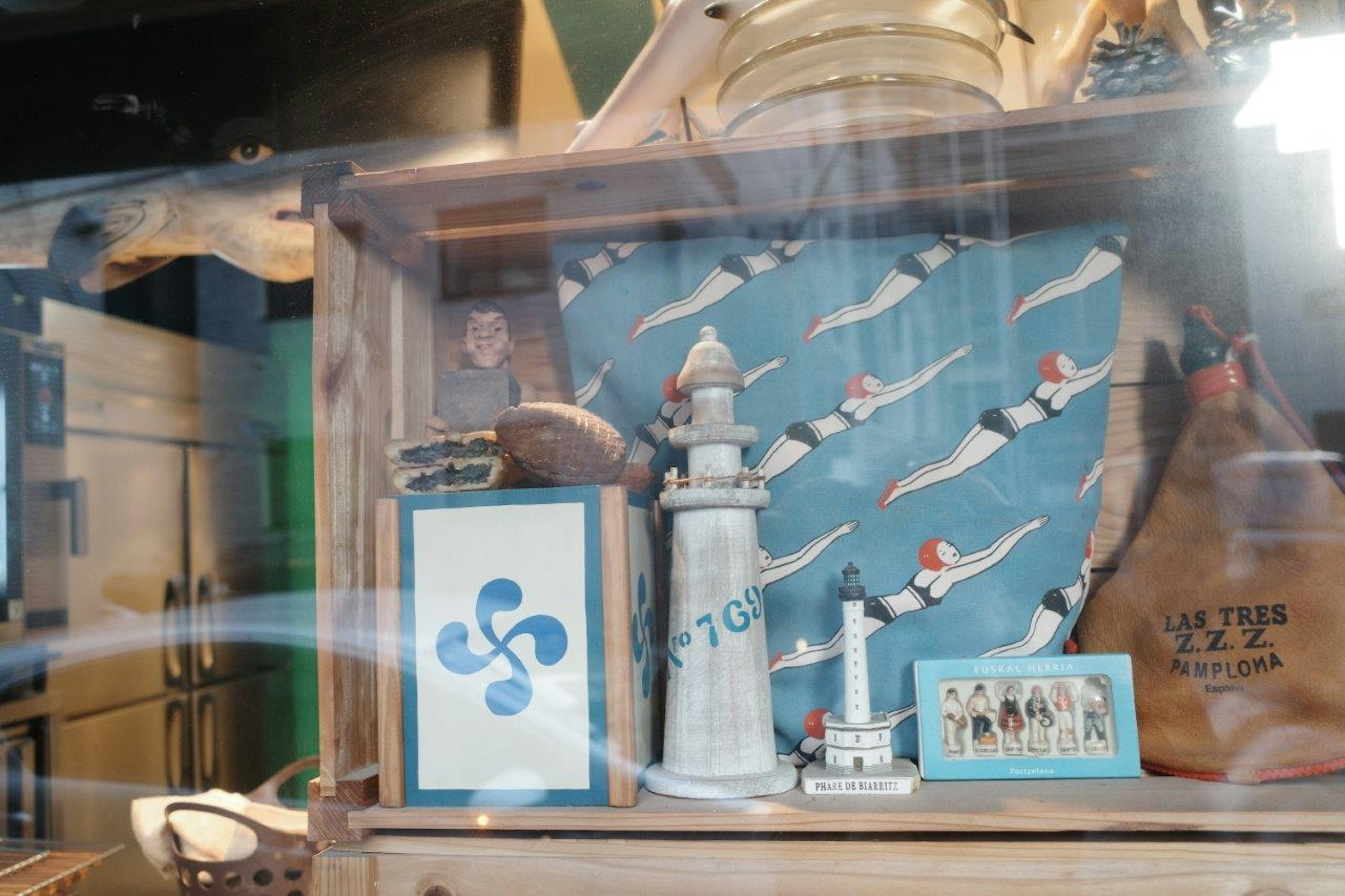 Display featuring nautical theme with lighthouse and blue background