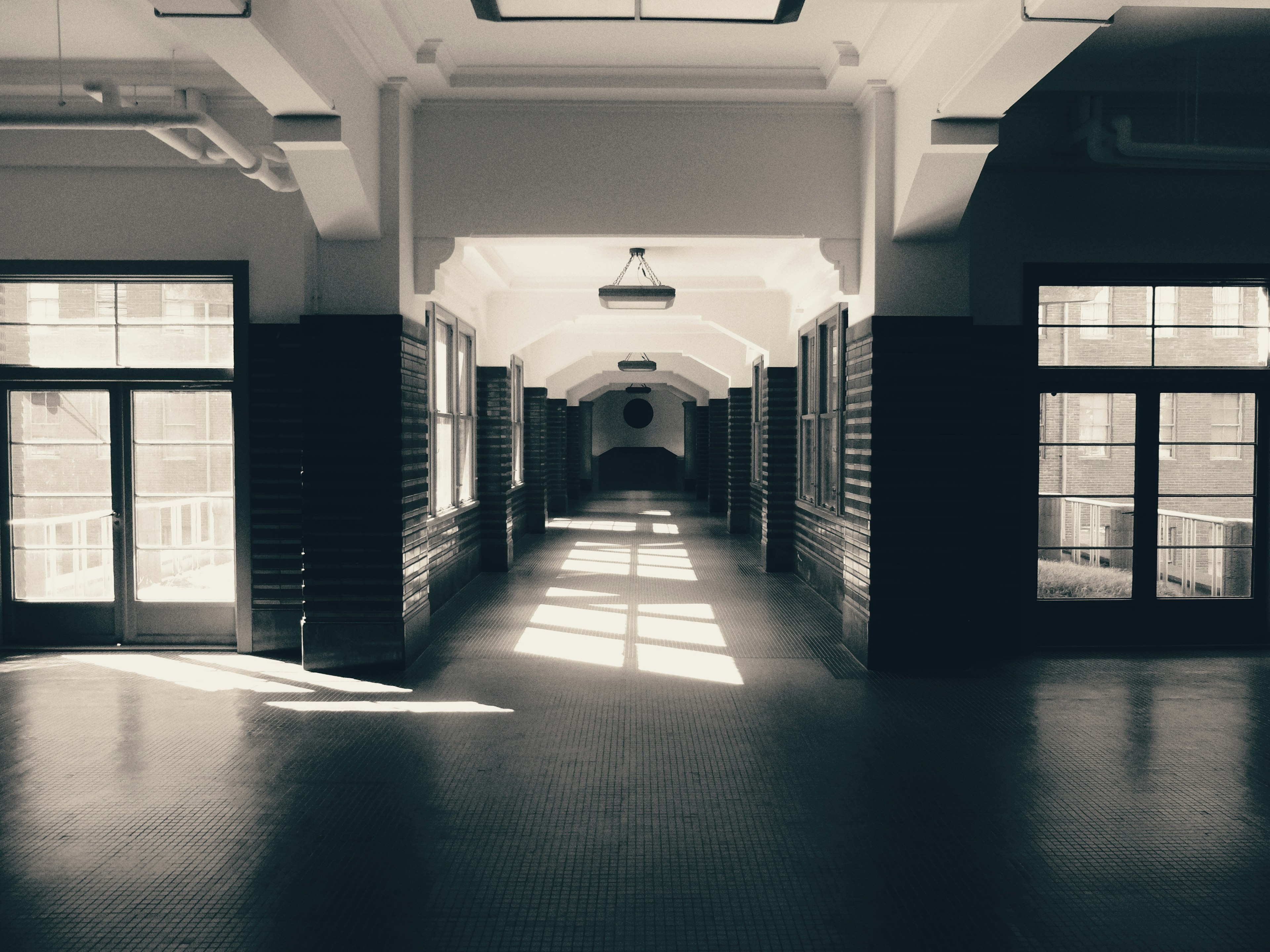 Spacious corridor with large windows in a minimalist architectural style