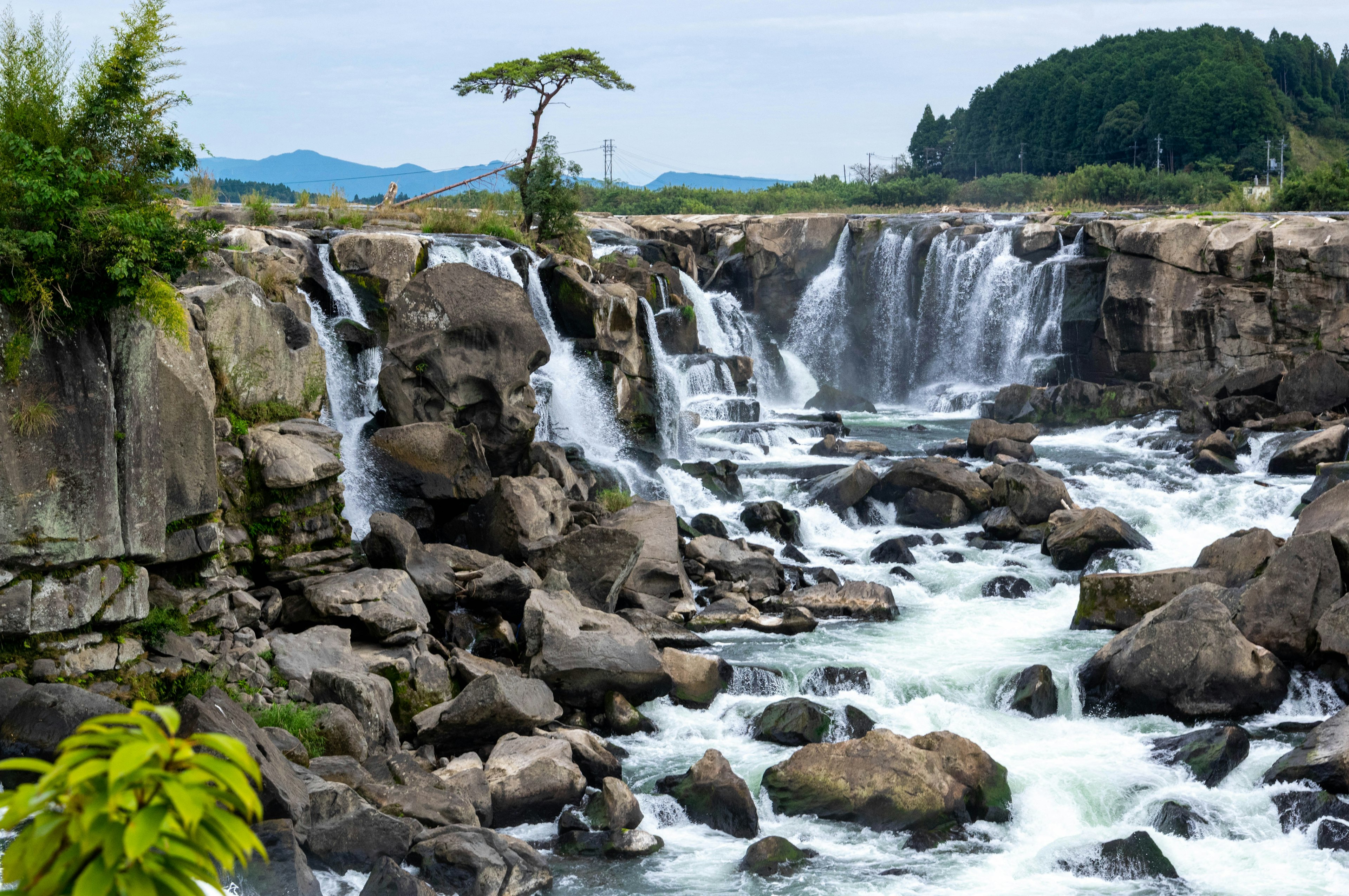 Beautiful waterfall cascading over rocks in a natural landscape