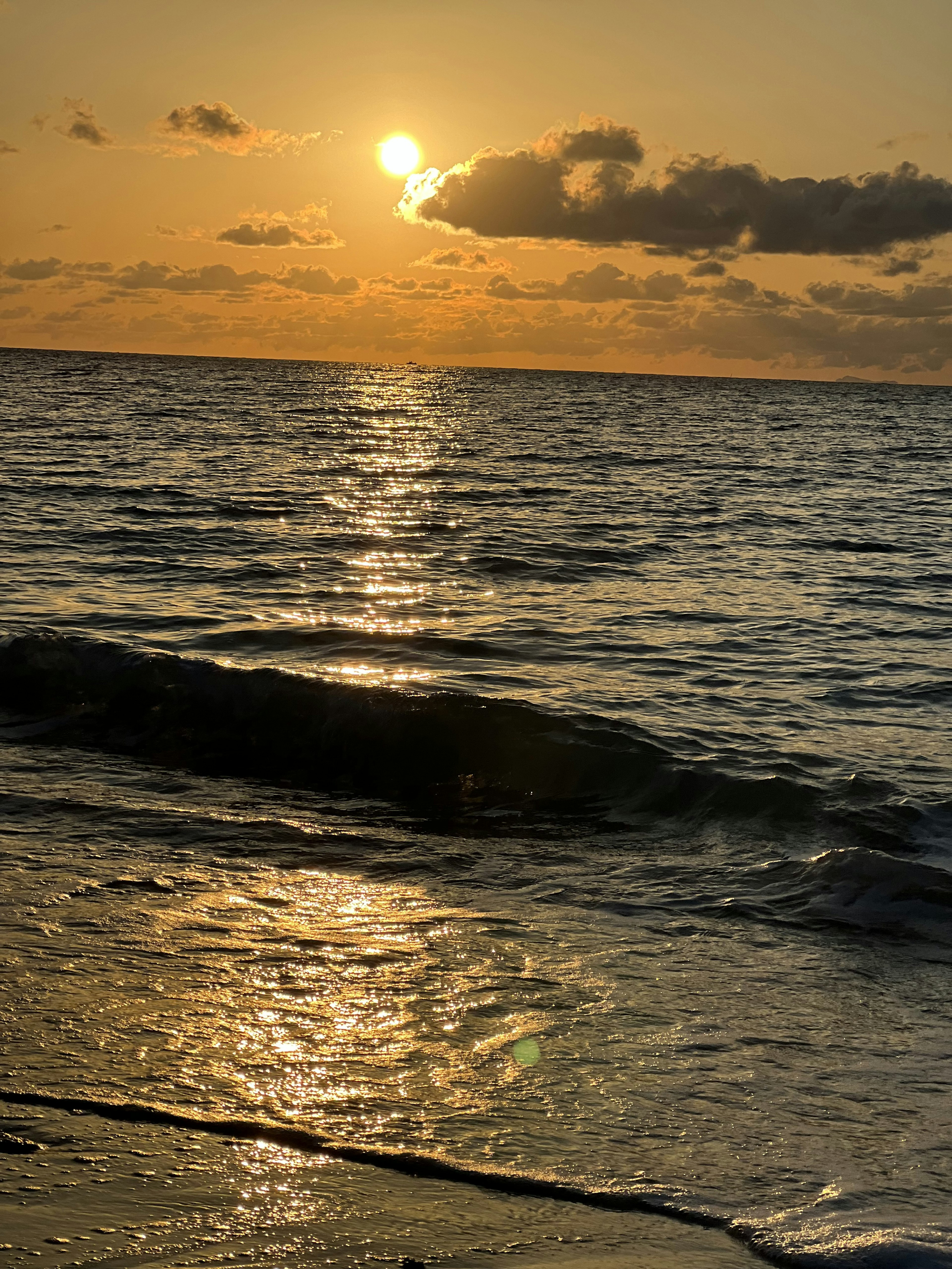 Beautiful seascape with waves and a glowing sunset