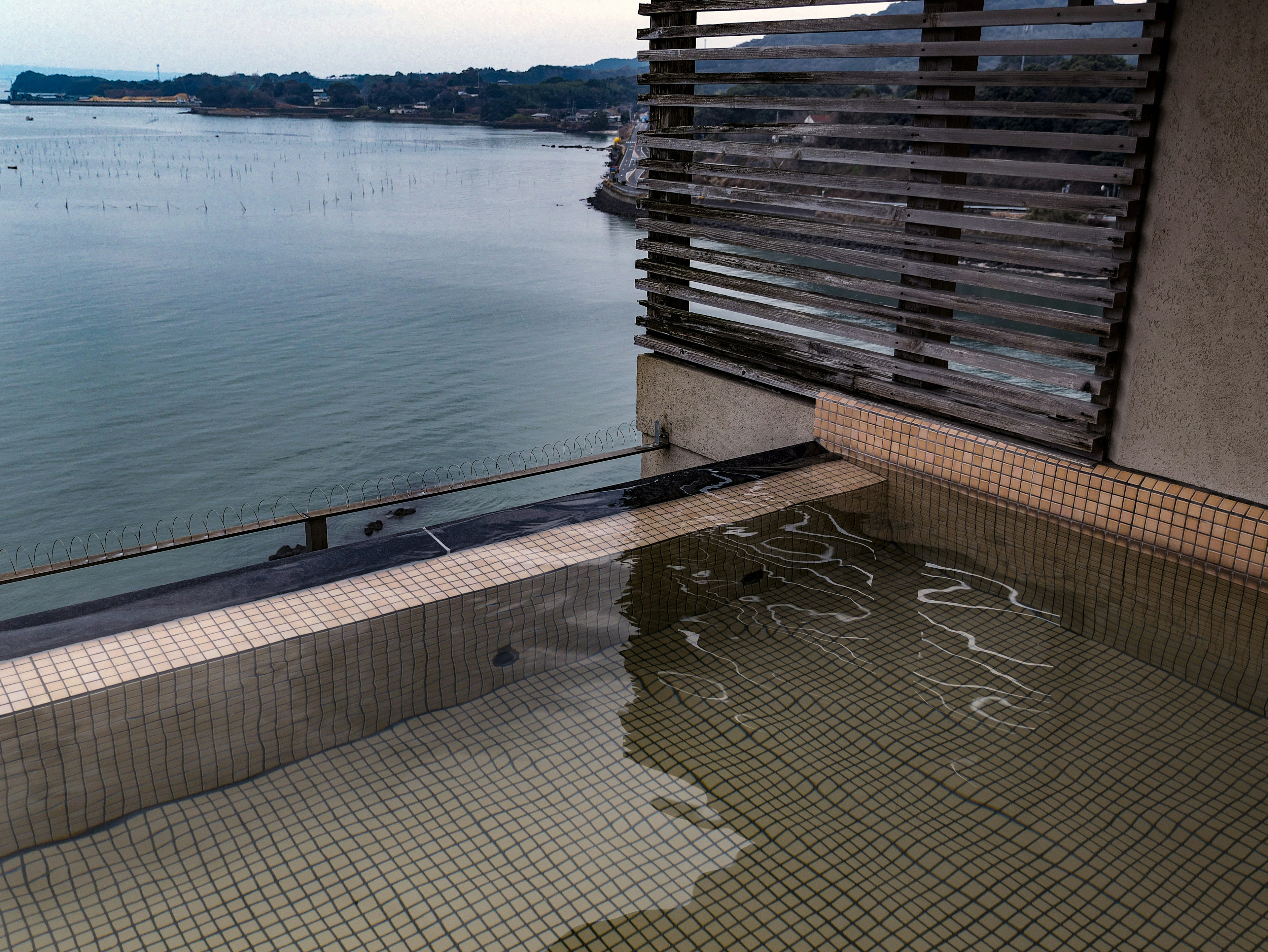 Rooftop hot spring pool overlooking the sea