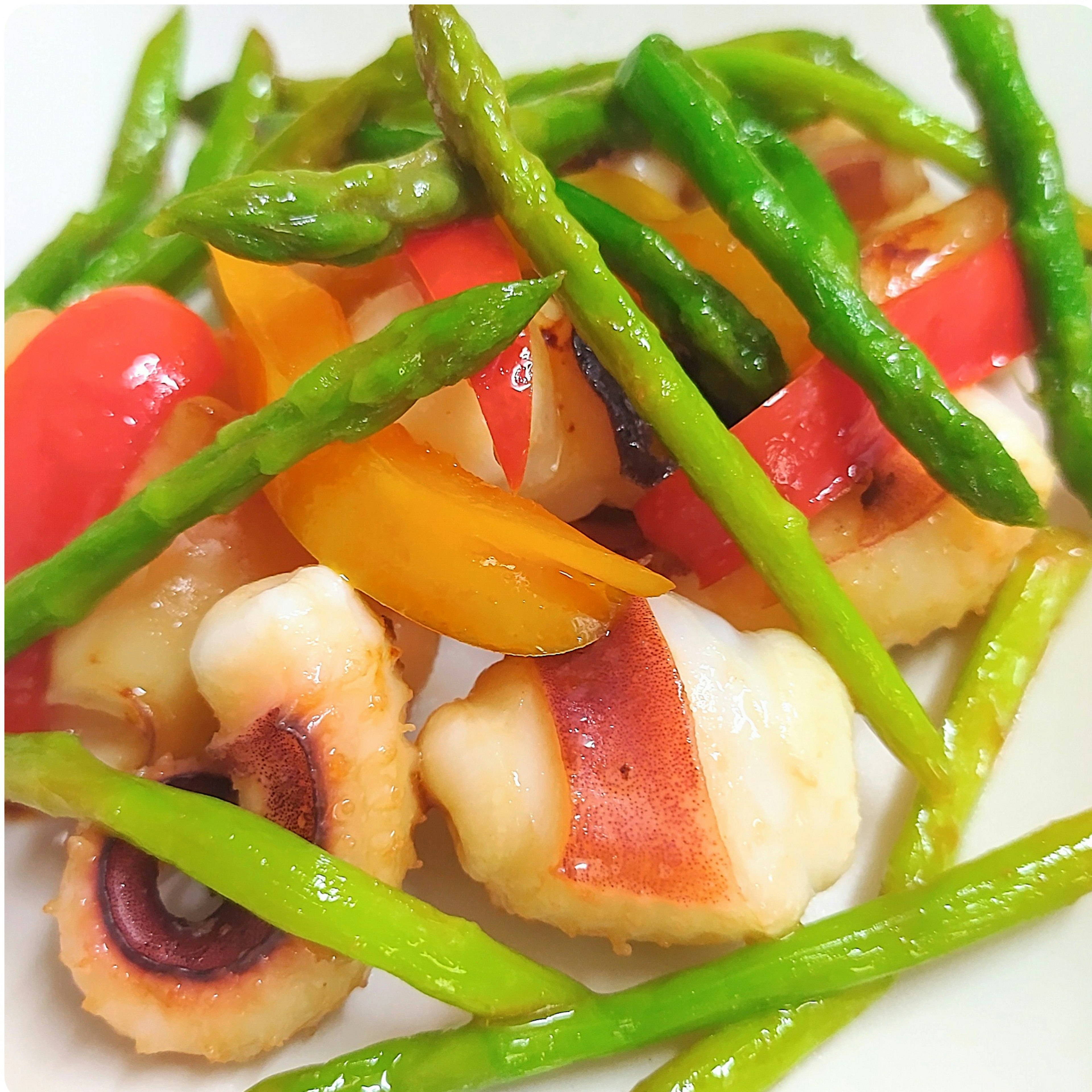 Colorful dish featuring octopus and vibrant vegetables