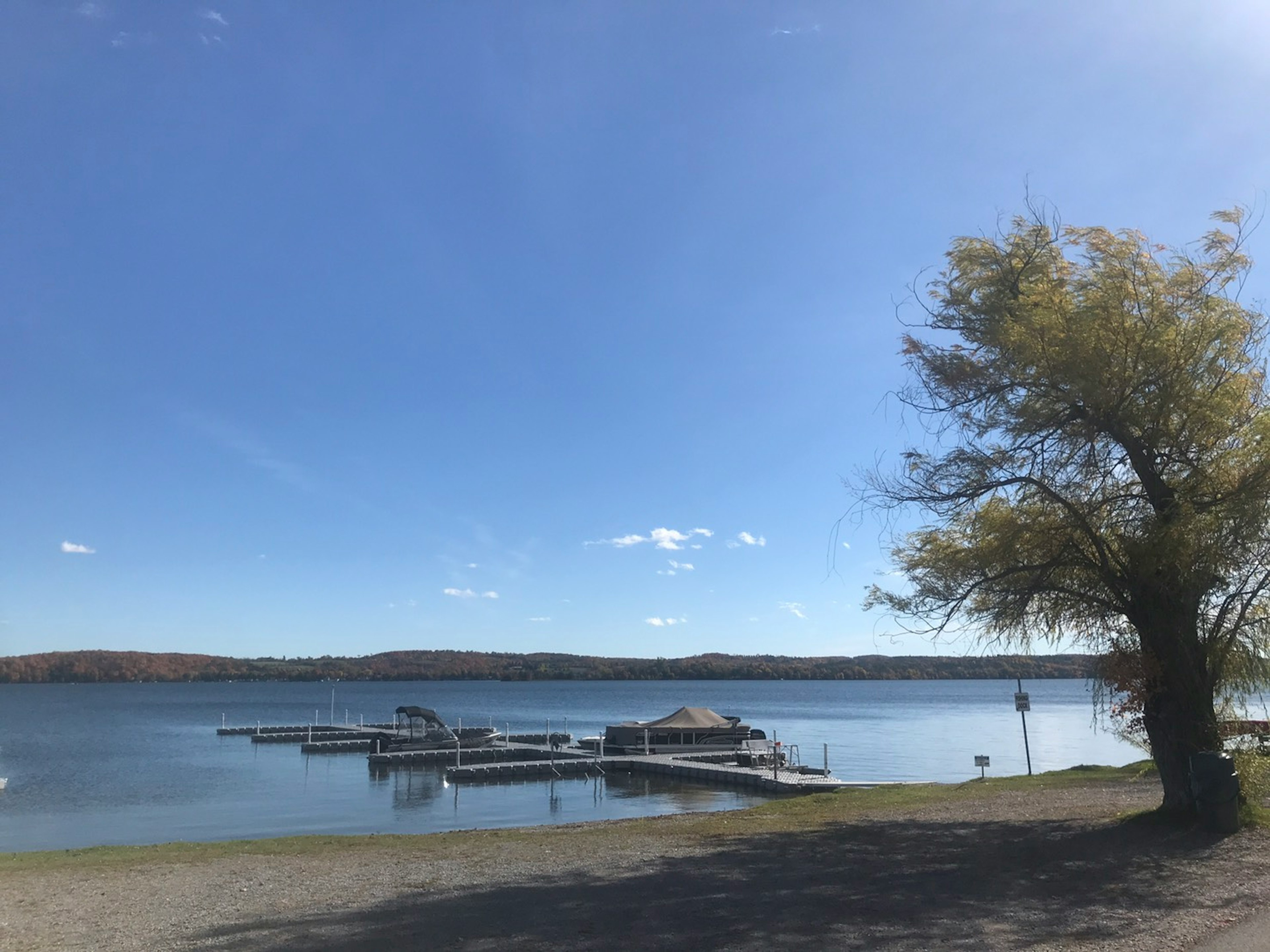 Scenic view of a lake with docks under a clear blue sky