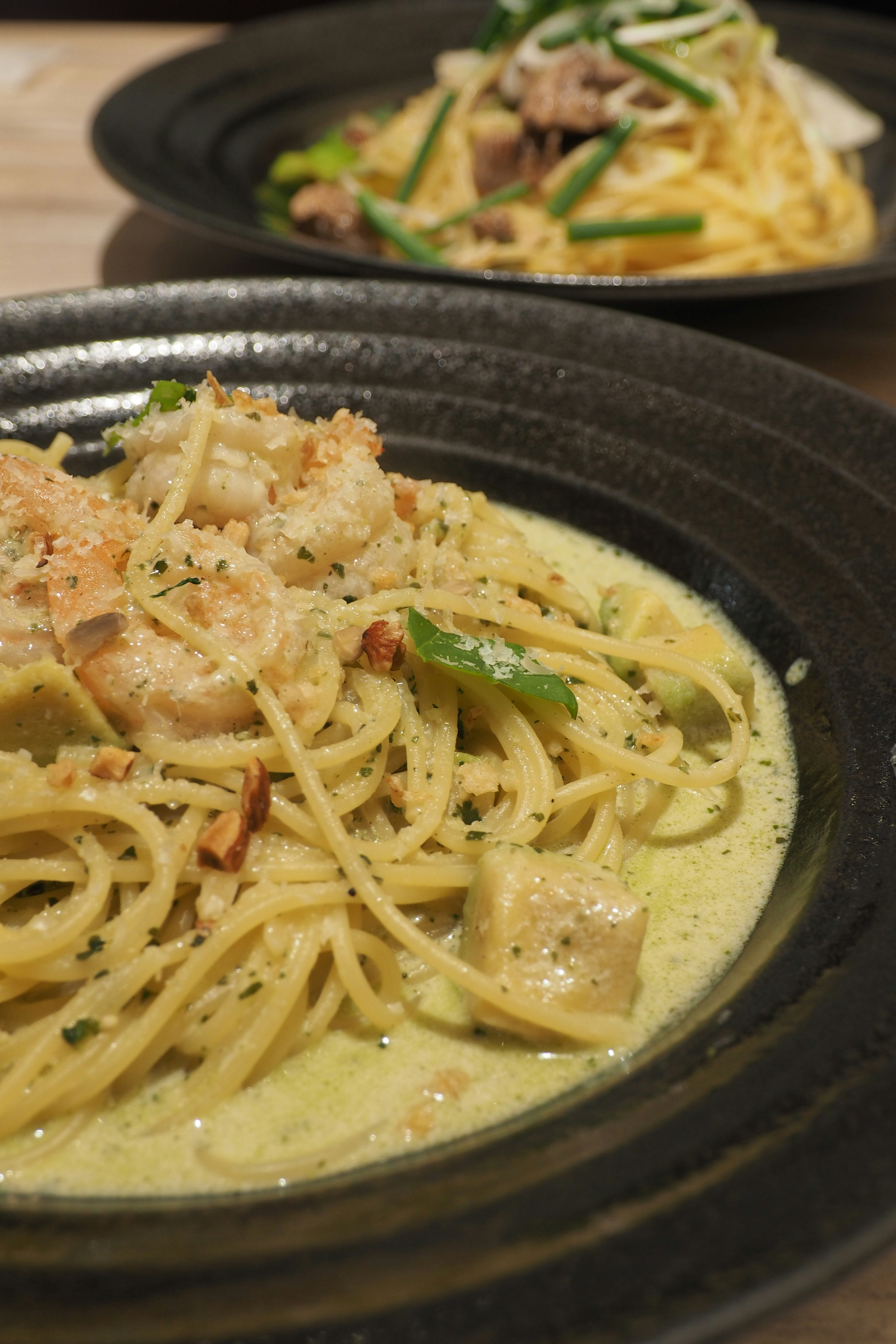 Creamy pasta dish served on a black plate