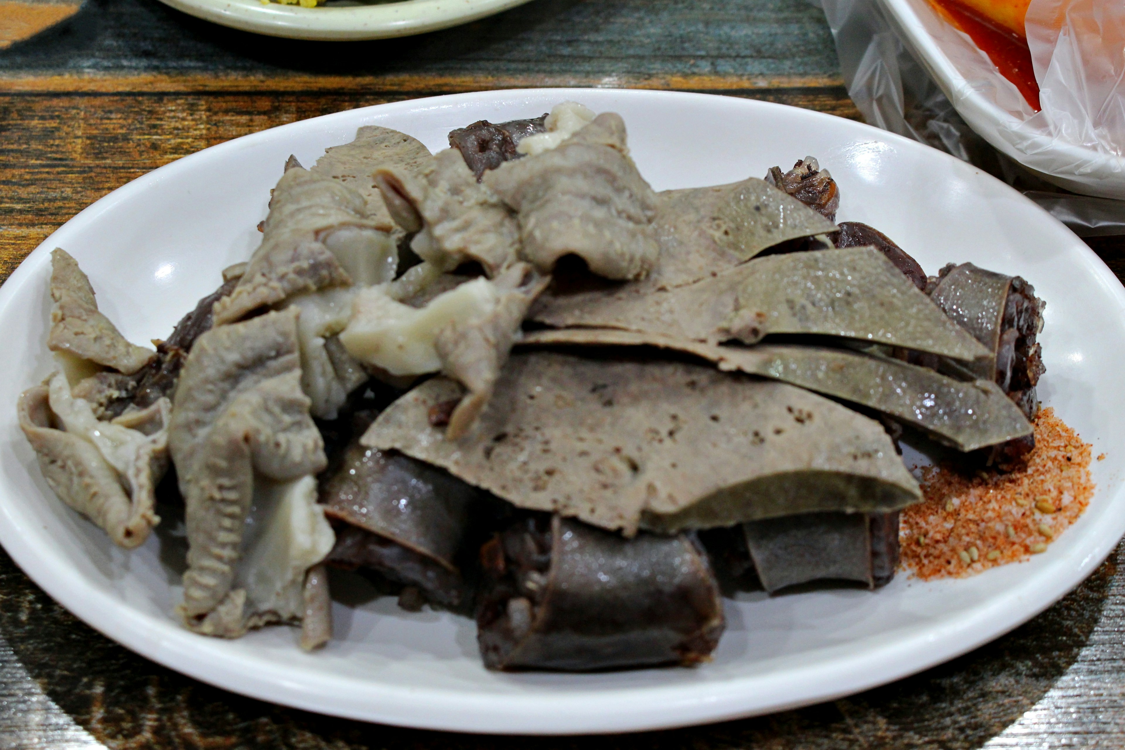 Sliced organ dish served on a white plate