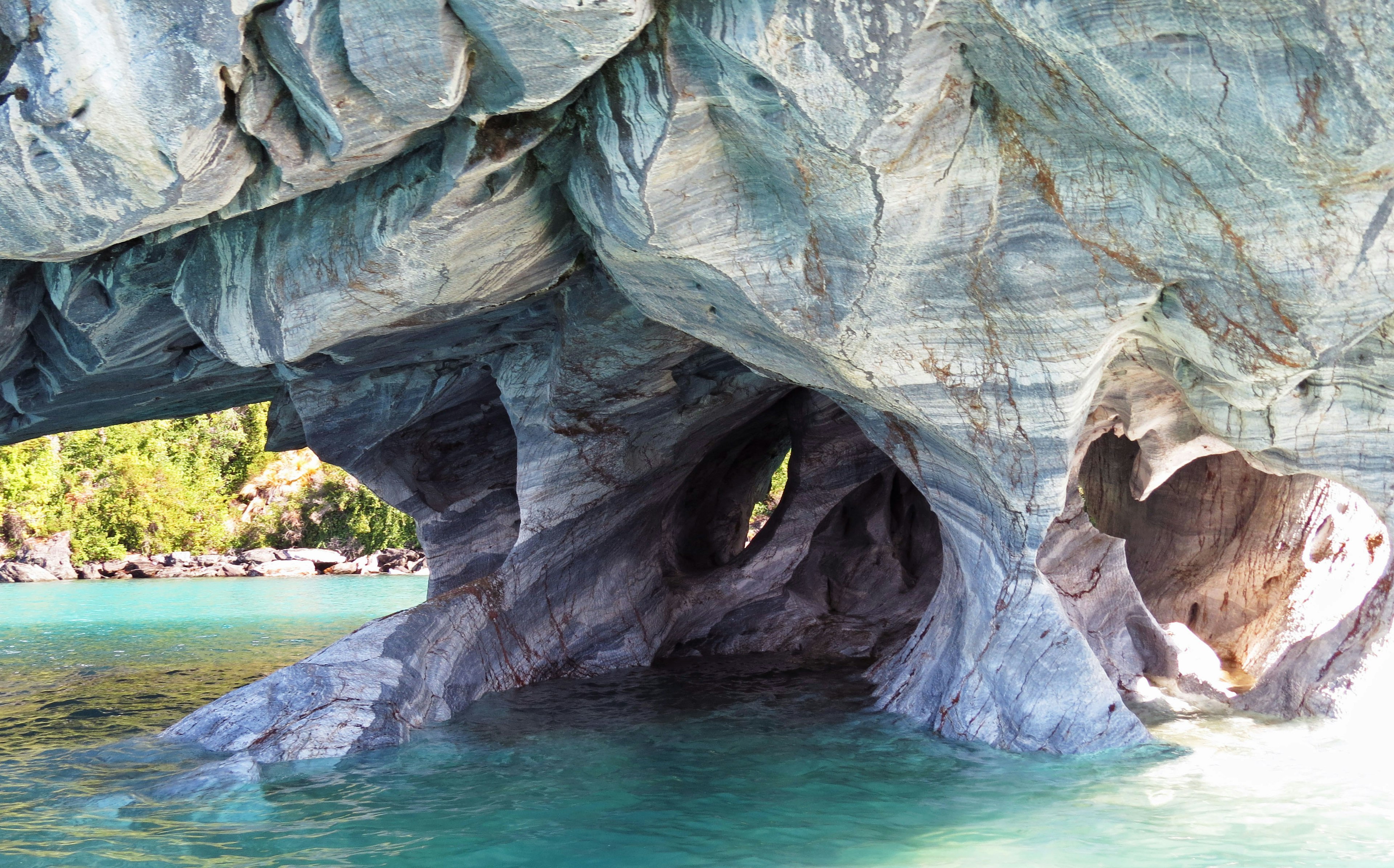 Beautiful marble cave arch in turquoise water