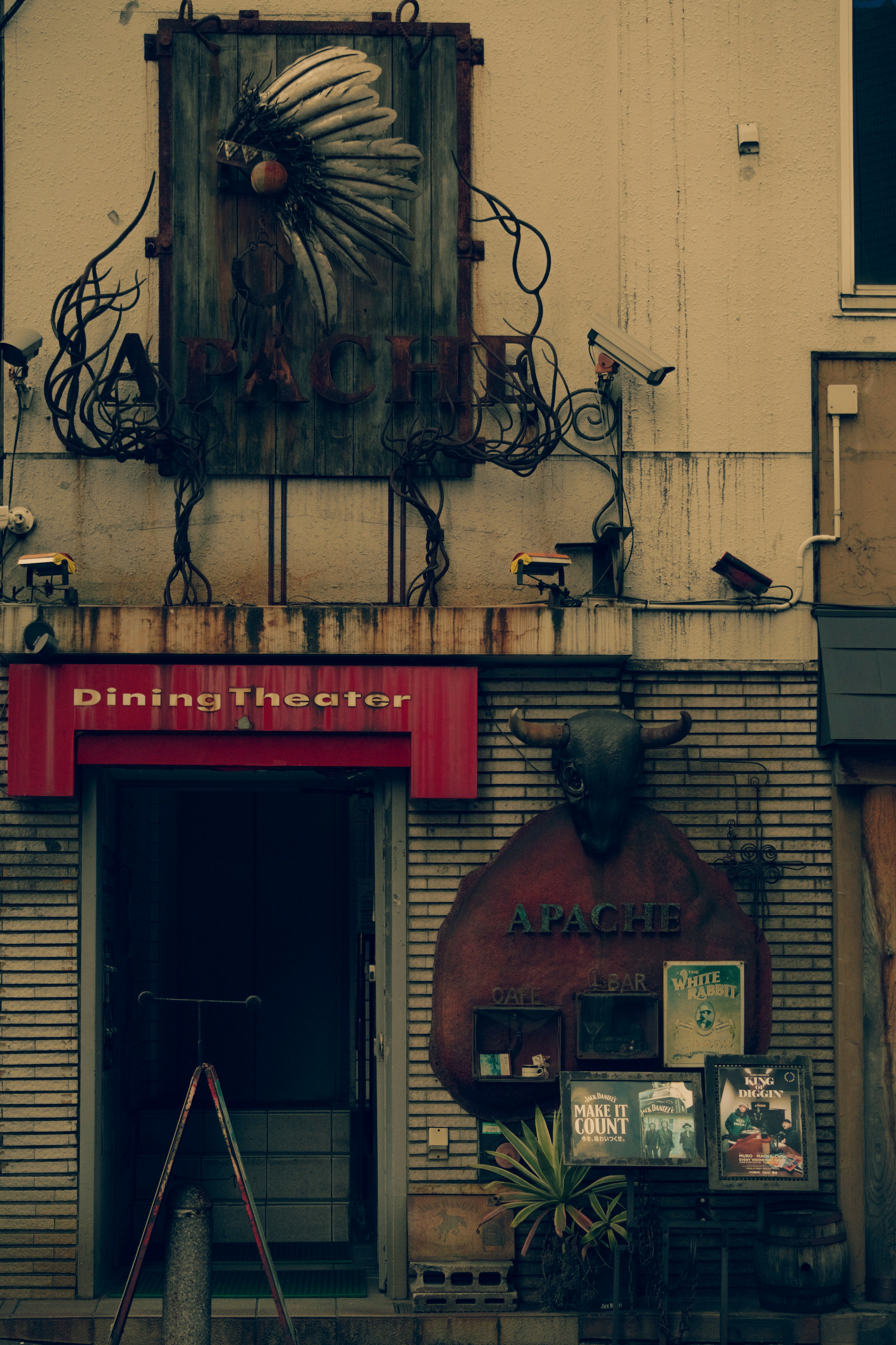 Exterior of a restaurant featuring a unique sign and decorative details