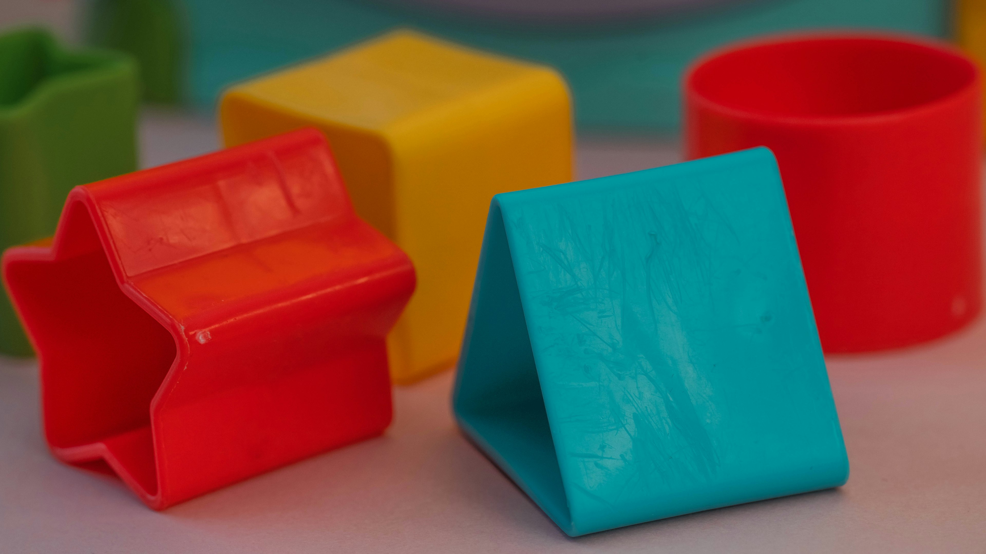 Colorful plastic shapes arranged on a surface