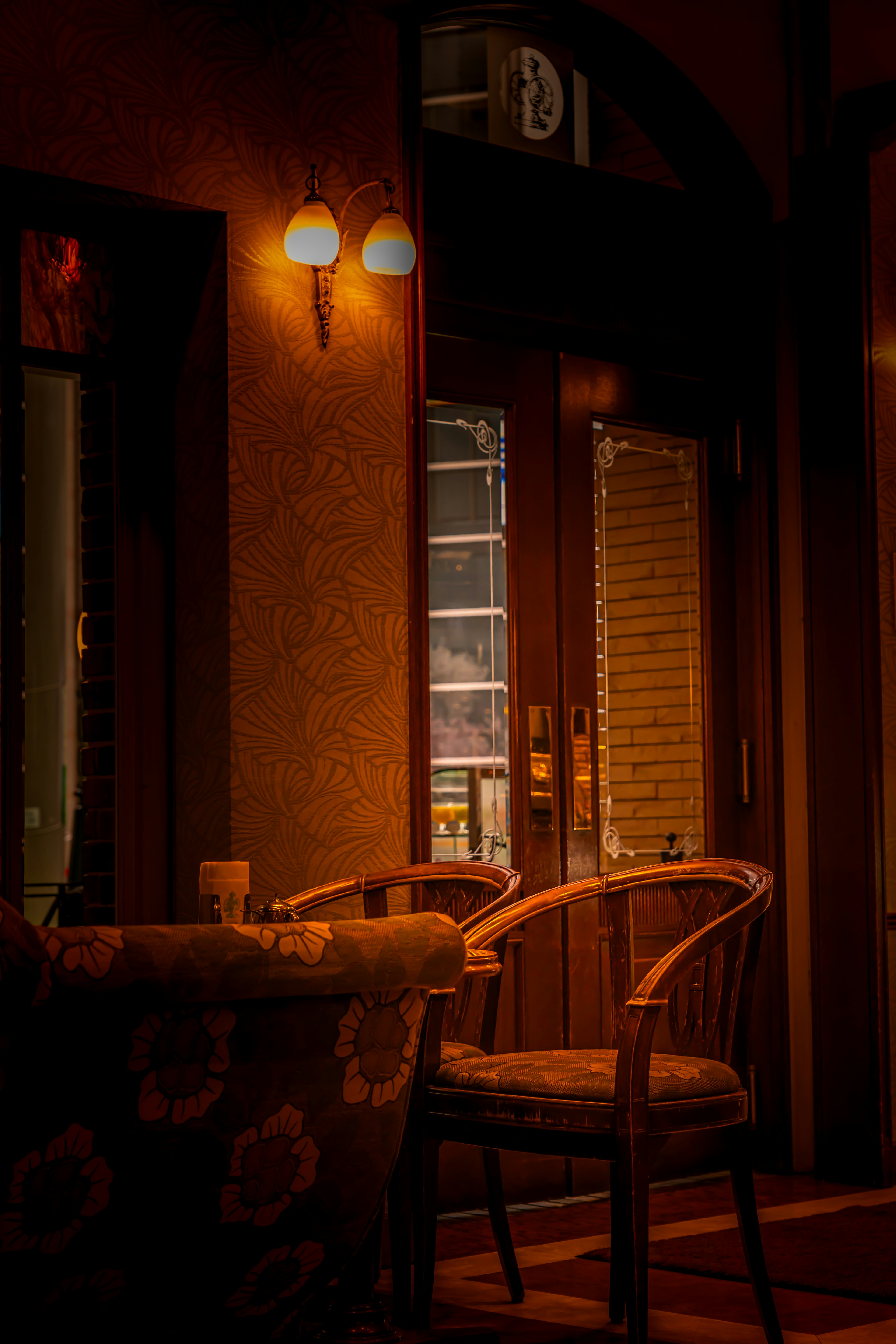 Cozy café interior with wooden chair and table warm lighting