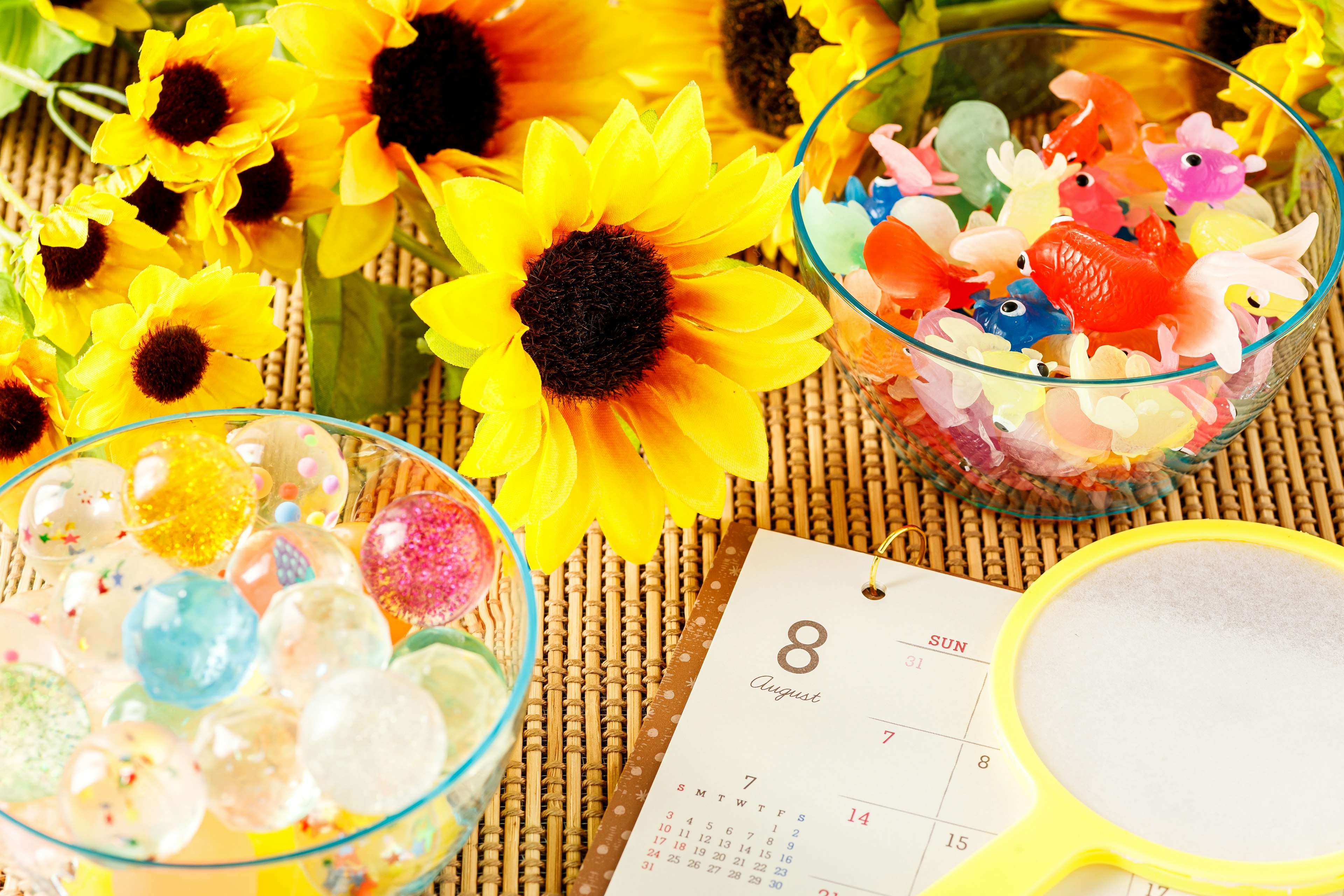 Bright still life with colorful bowls and sunflowers