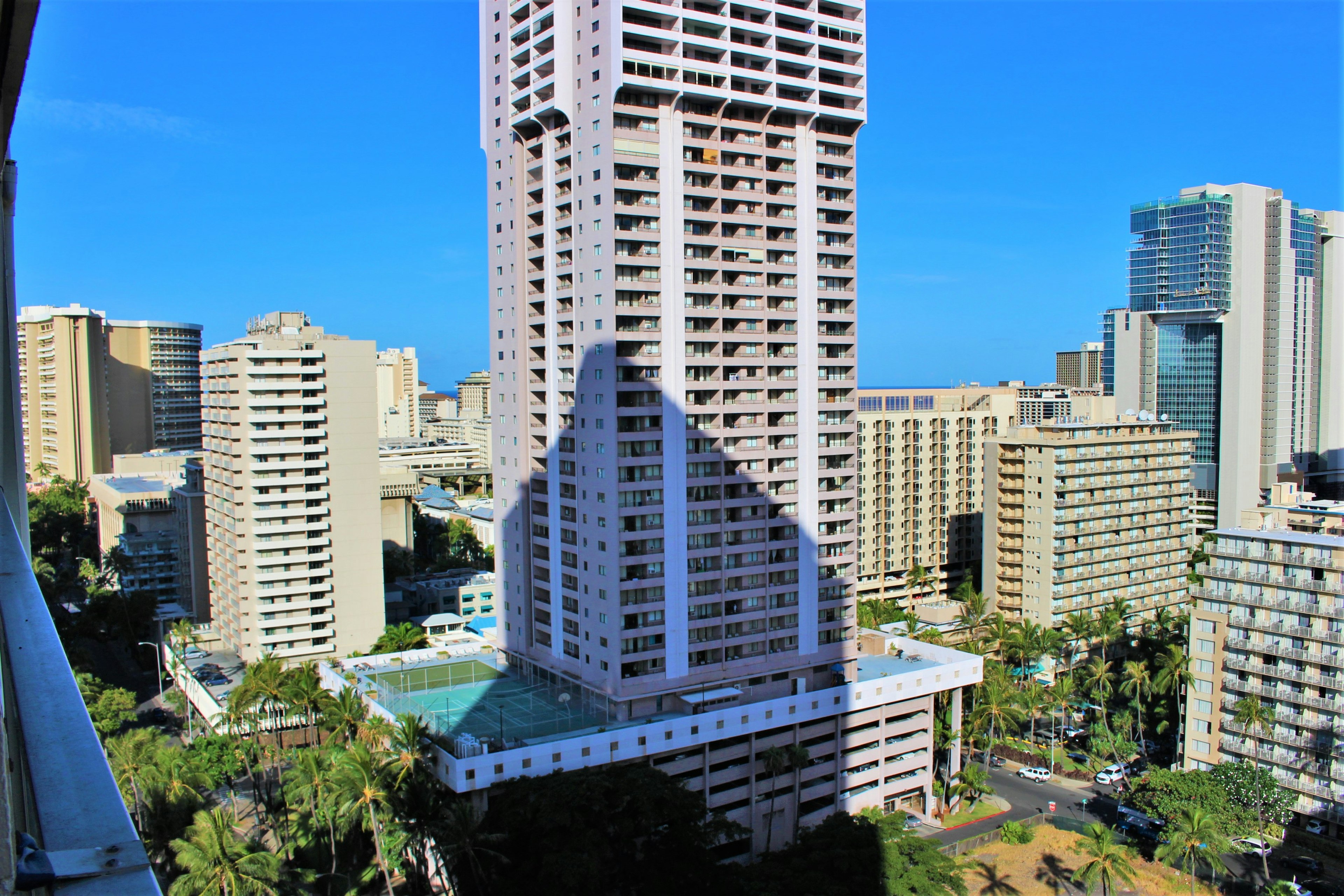 City skyline featuring high-rise buildings and a clear blue sky