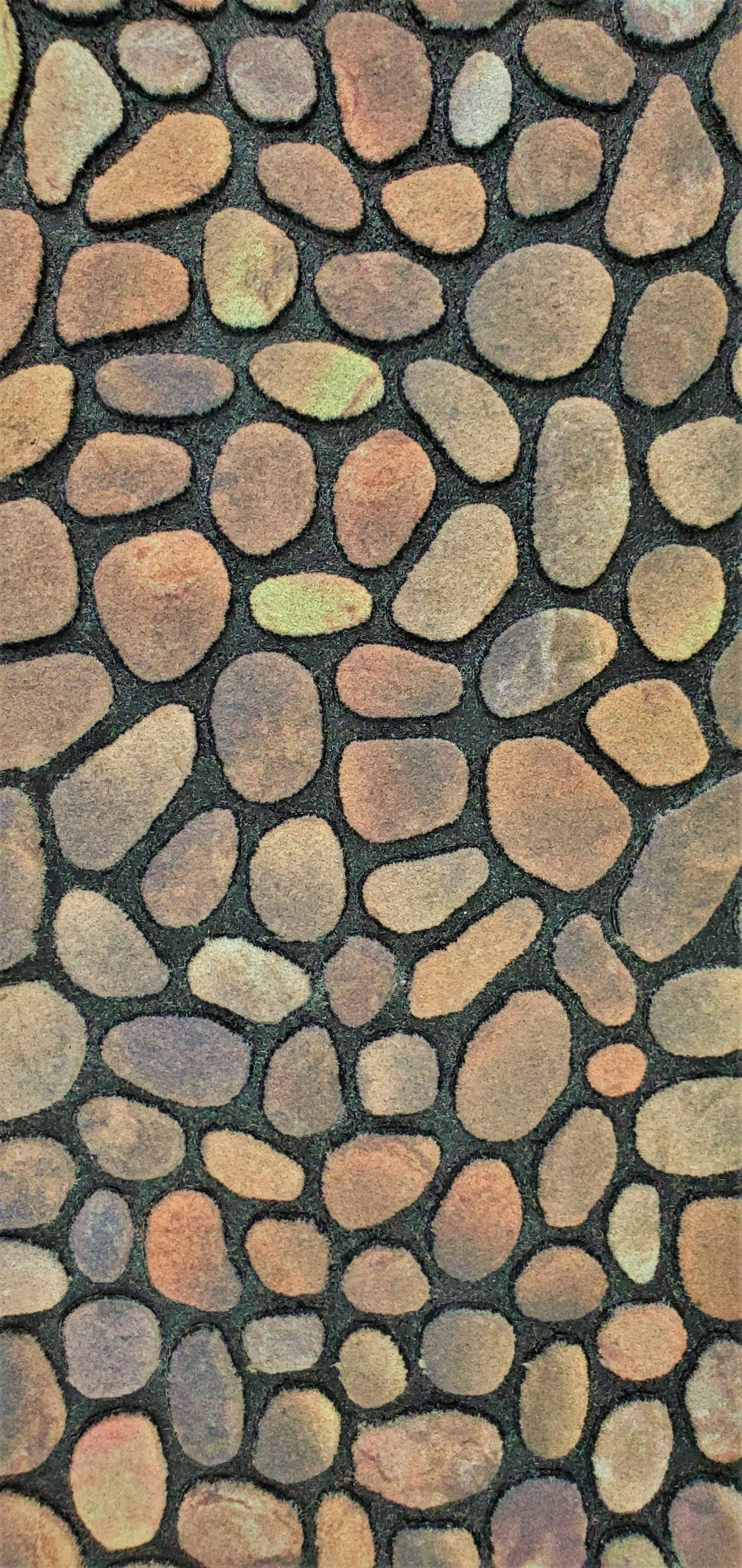 Pattern of various colored stones arranged closely