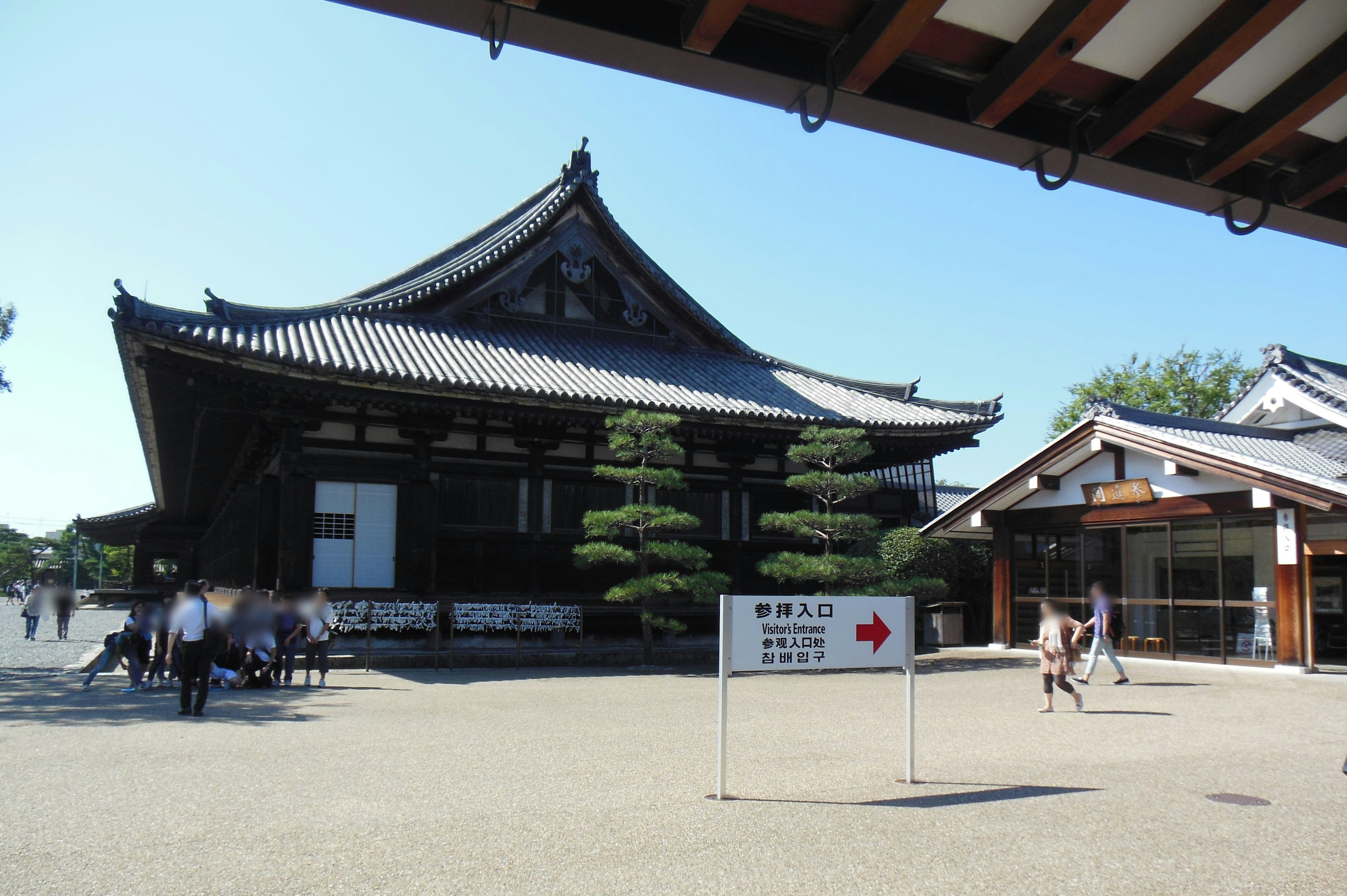 Traditional Japanese temple architecture with manicured gardens