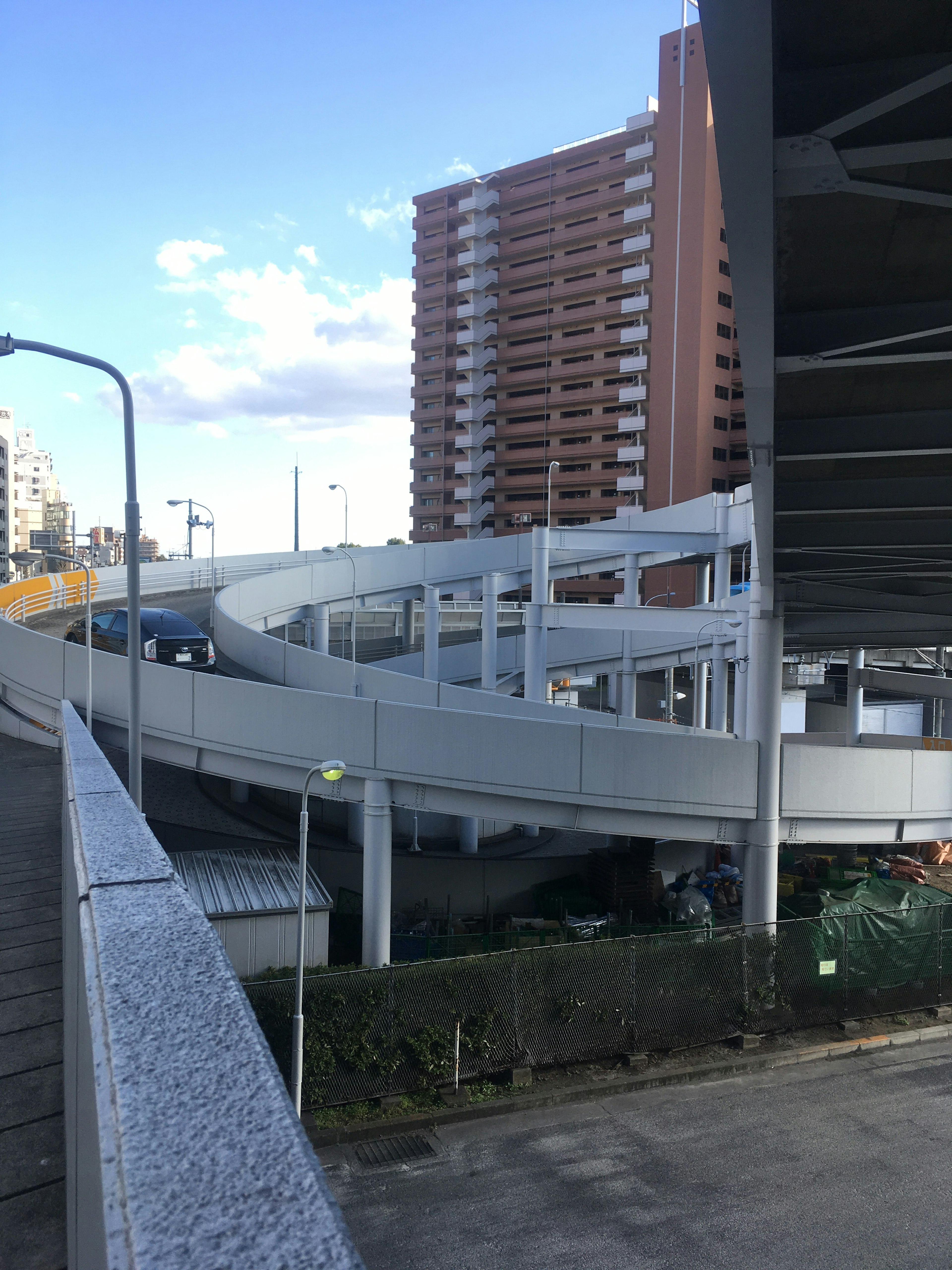 Urban overpass with apartment buildings in the background