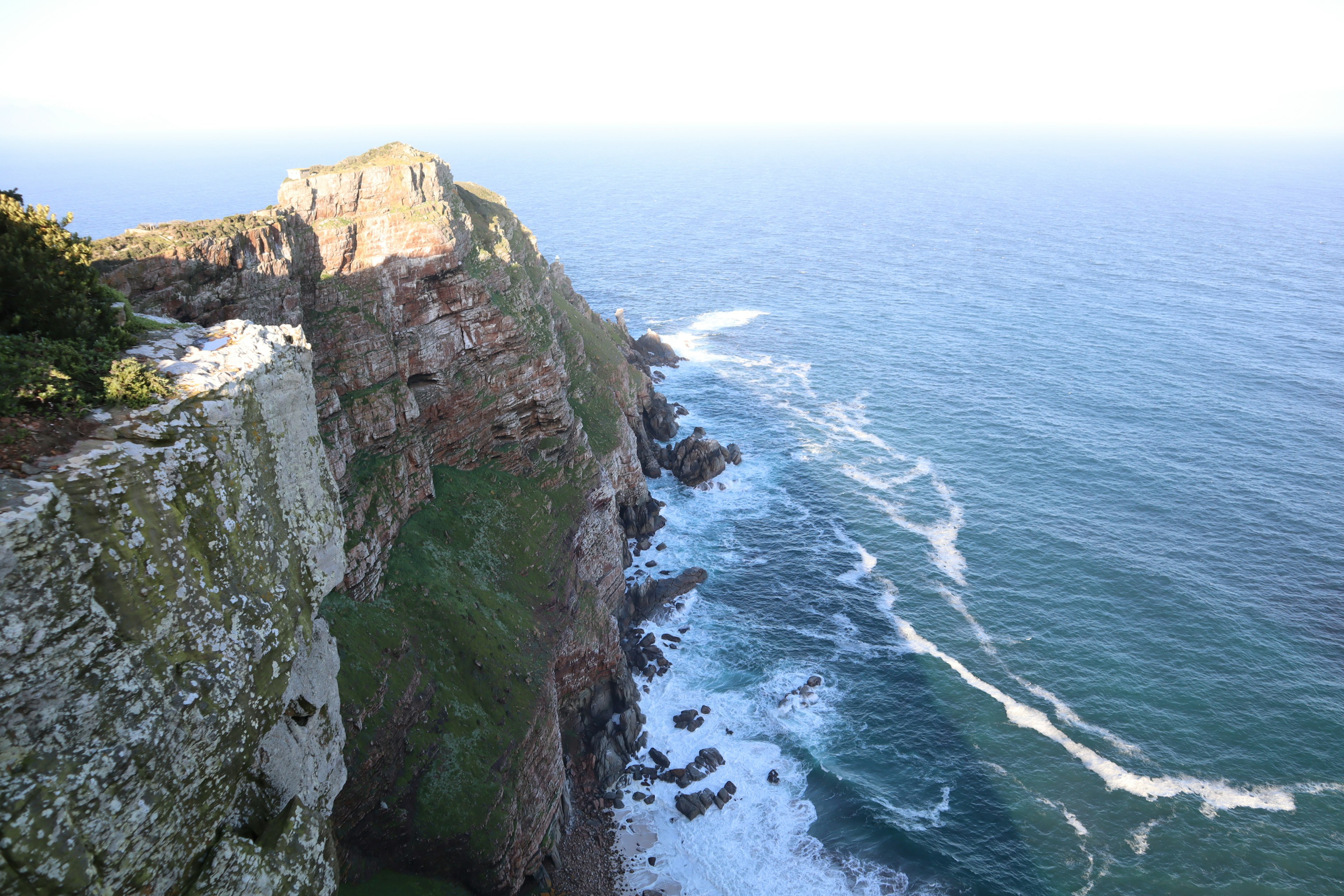 Scenic cliffside view along the coastline with ocean waves