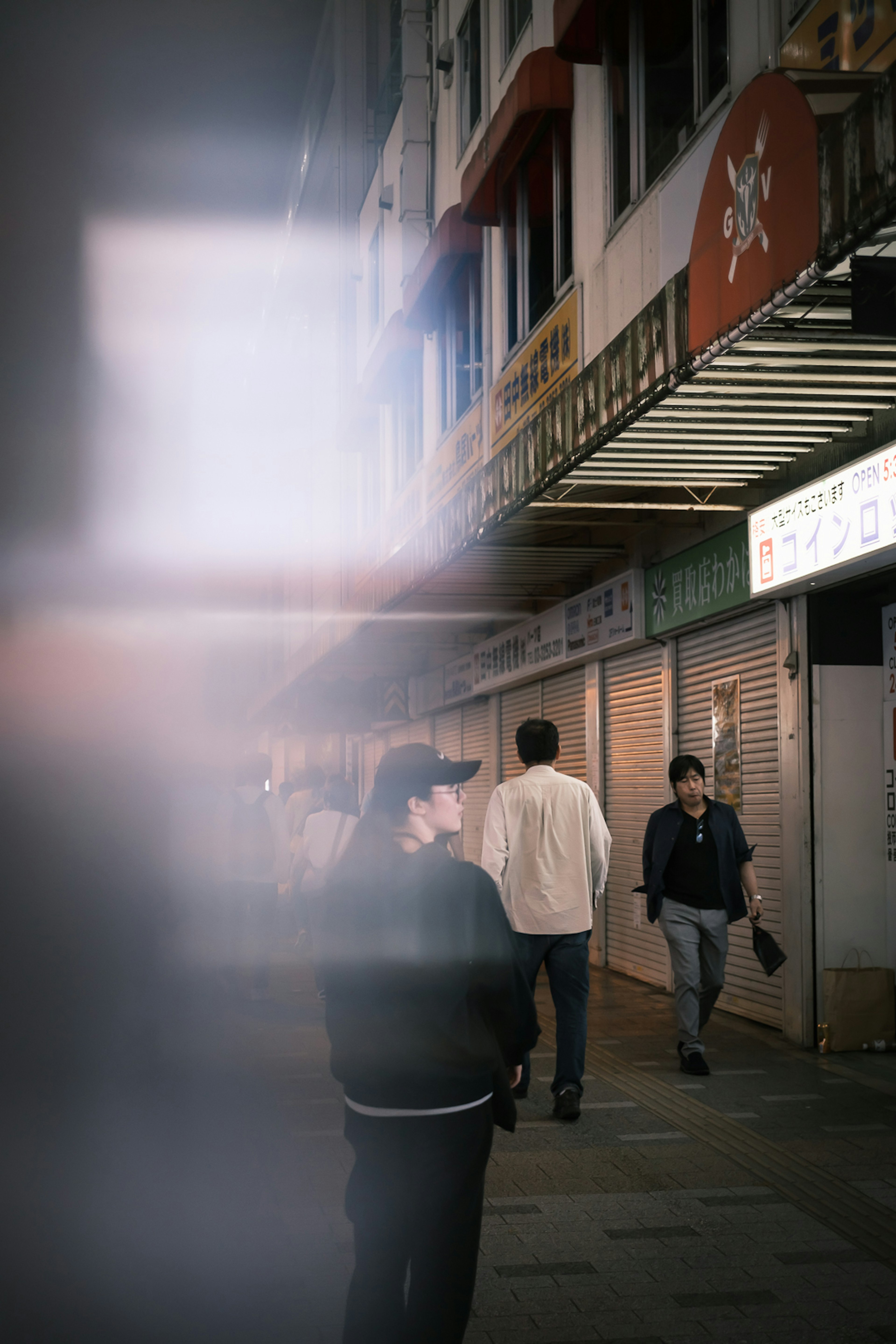 Blurred street scene with people walking