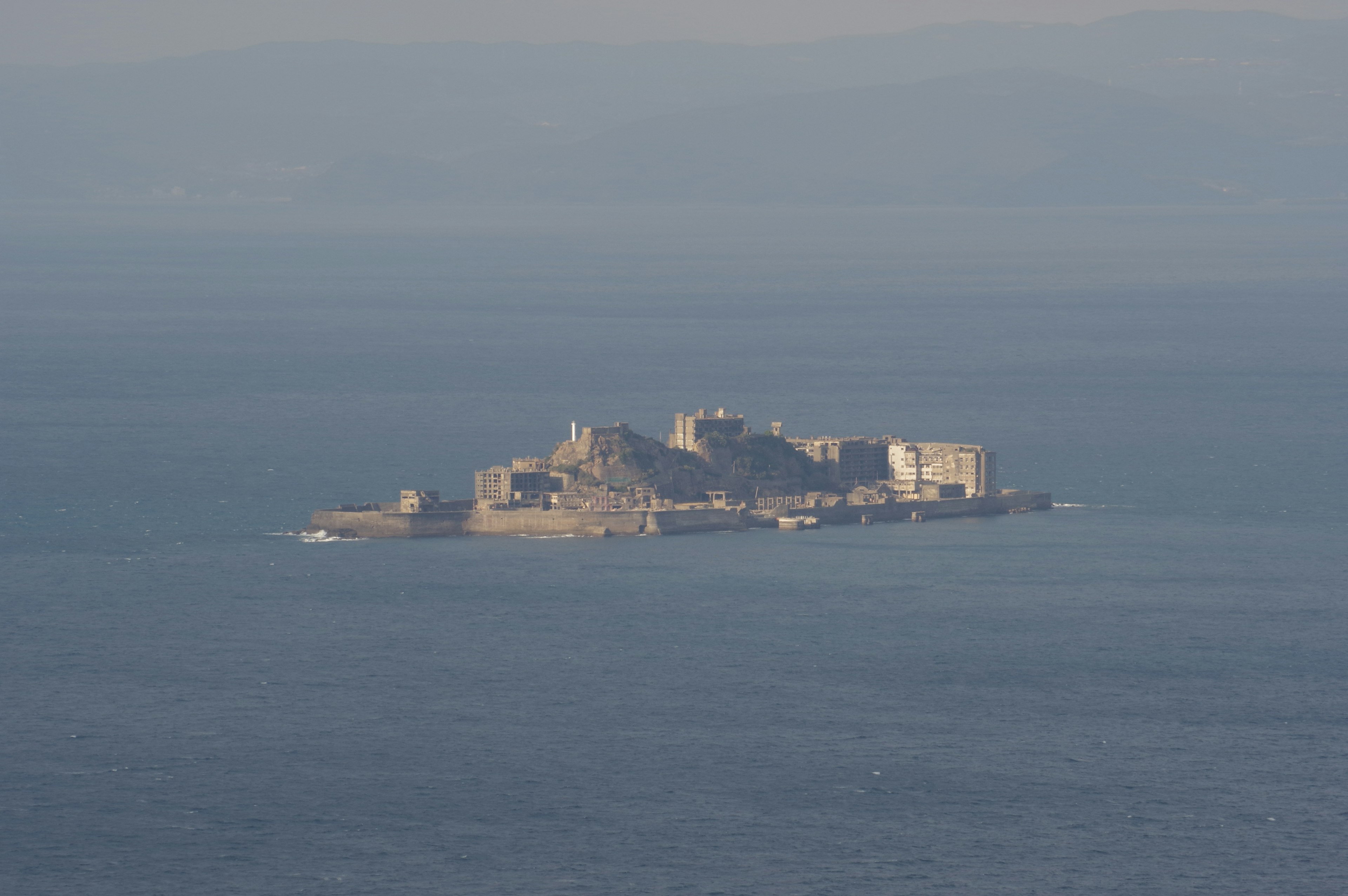 A small island with historic buildings in the sea