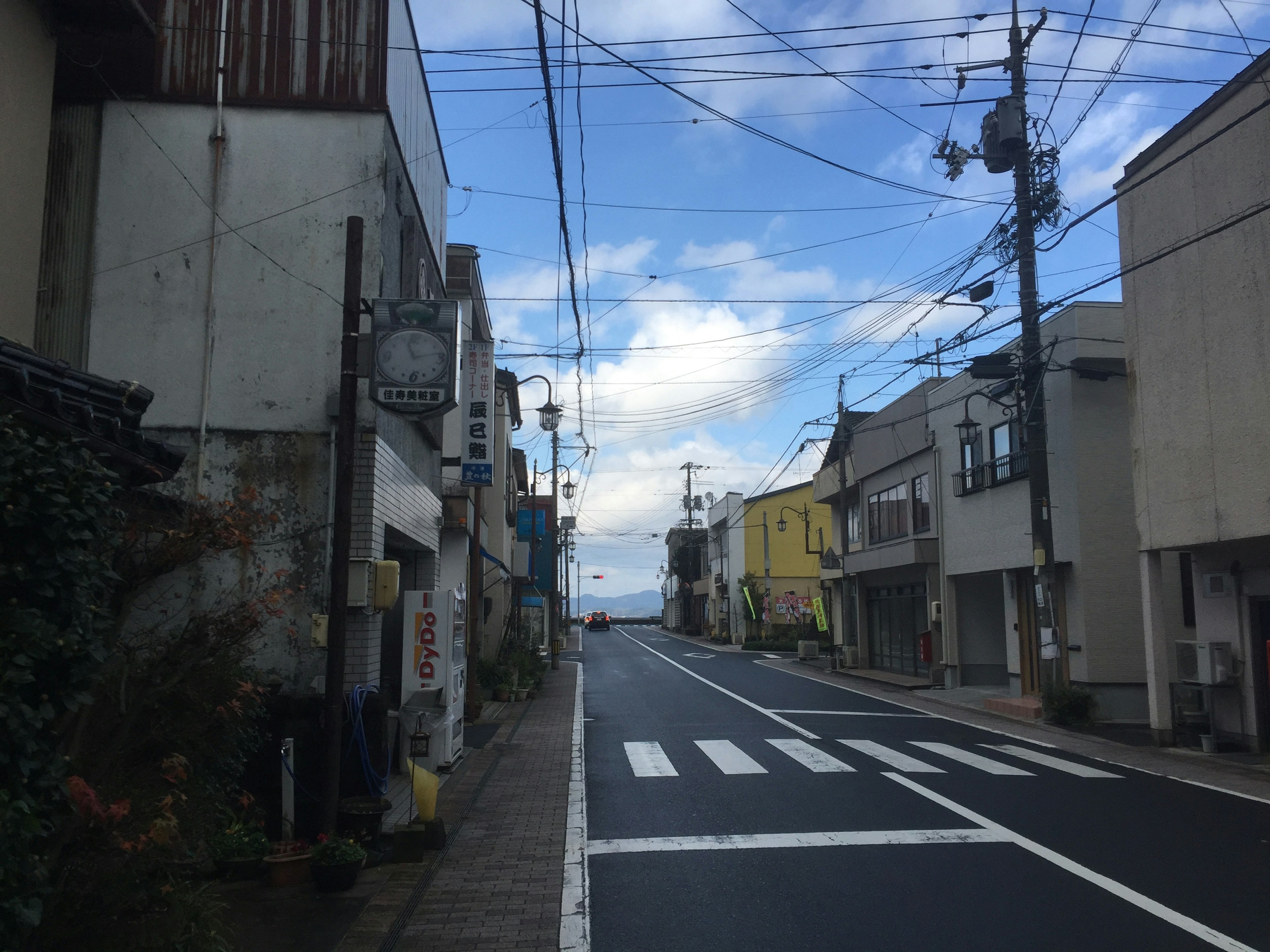 Quiet street scene with buildings and blue sky