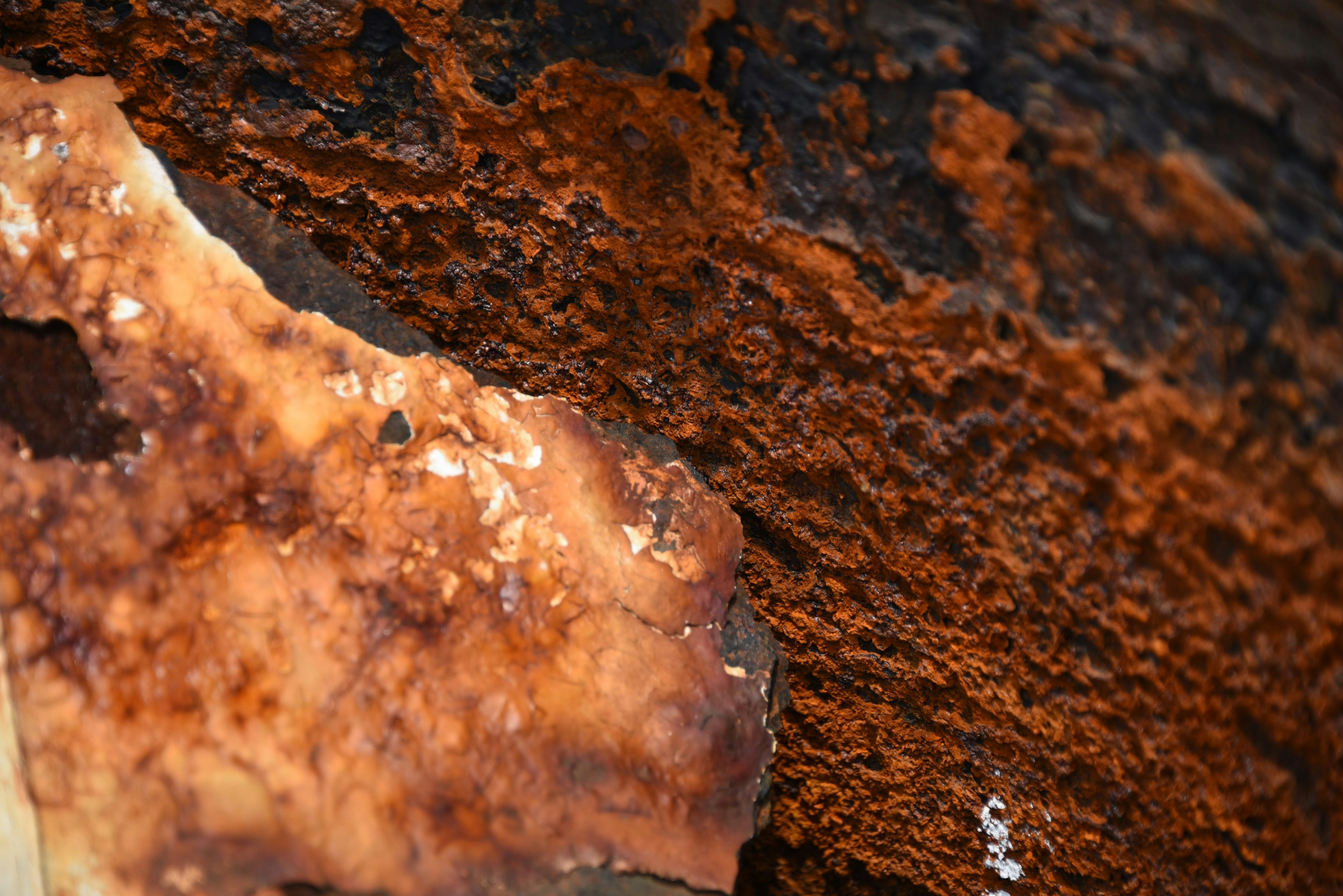 Rusty metal surface with textures of burnt wood