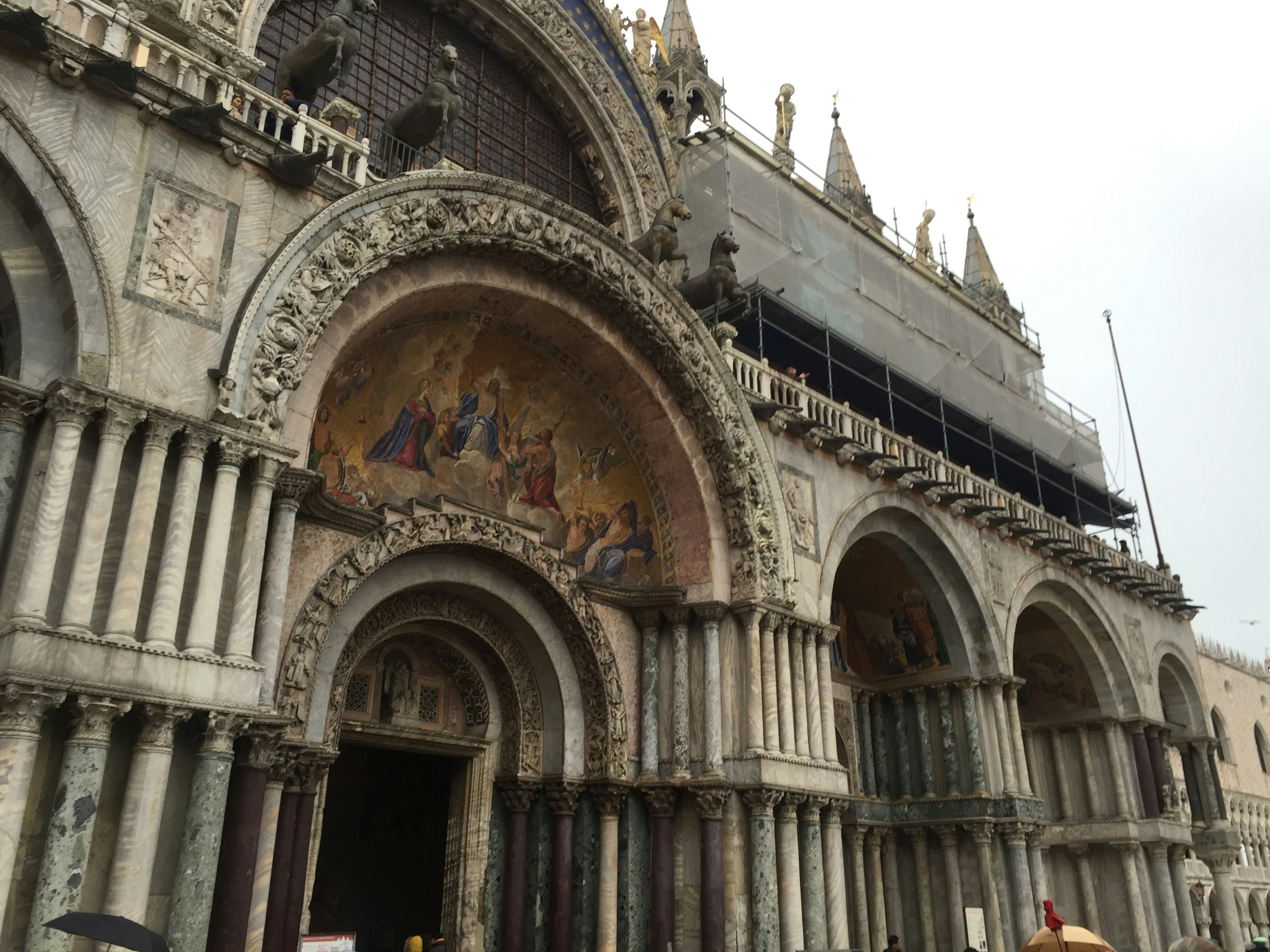 Facade of St Mark's Basilica featuring mosaics archways and intricate sculptures historical architecture