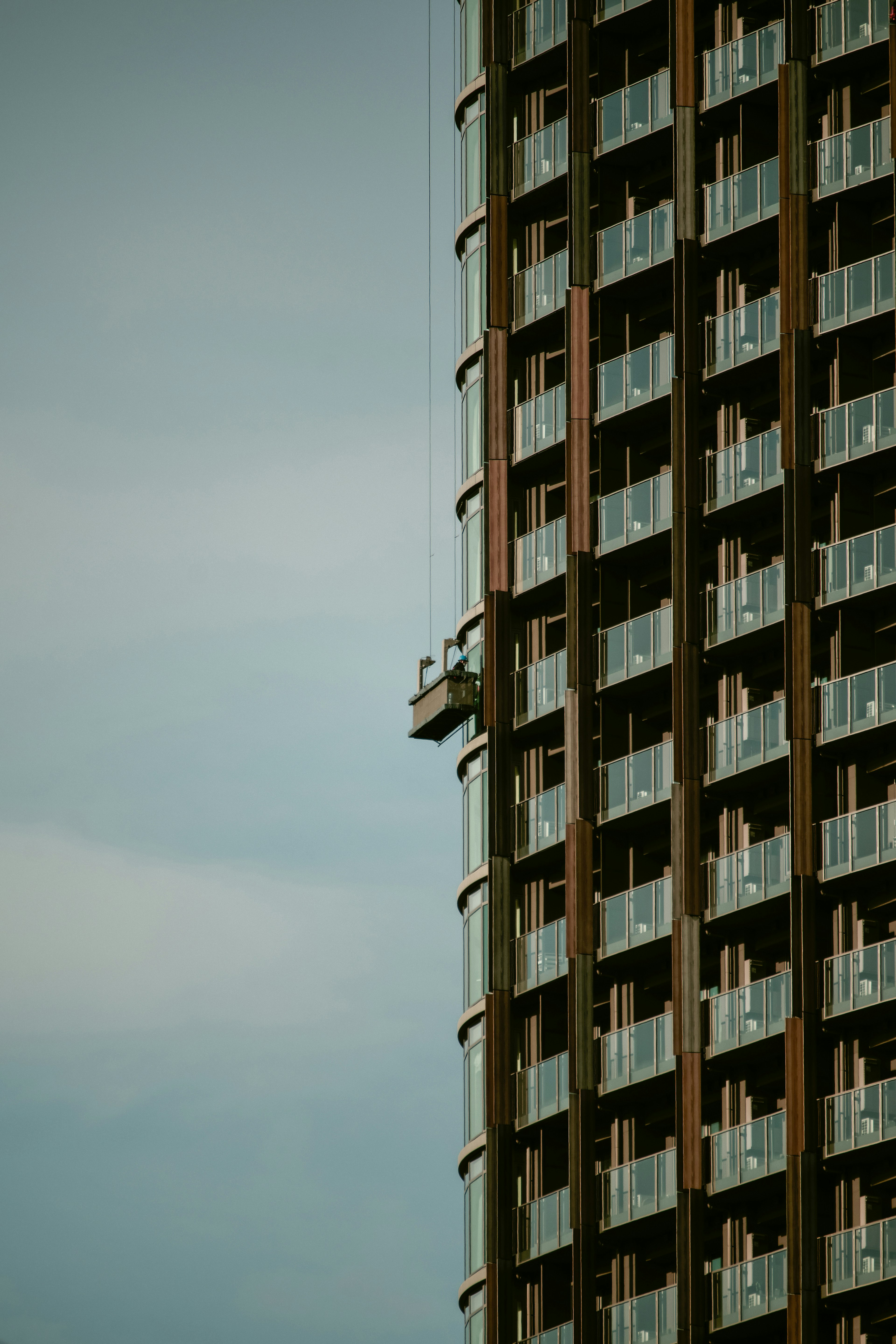 Side view of a high-rise building featuring balconies