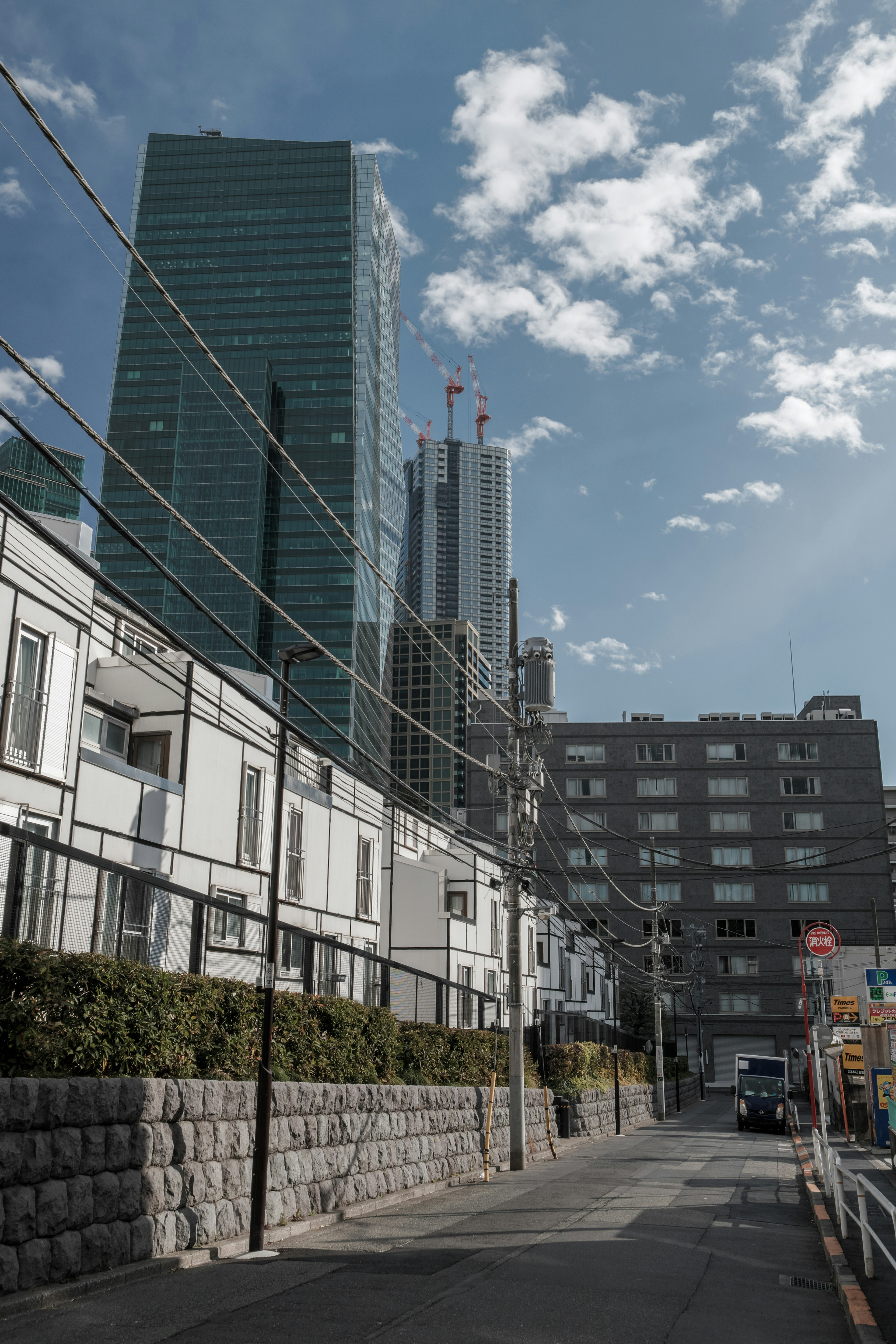 Urban scene with modern skyscrapers and traditional houses